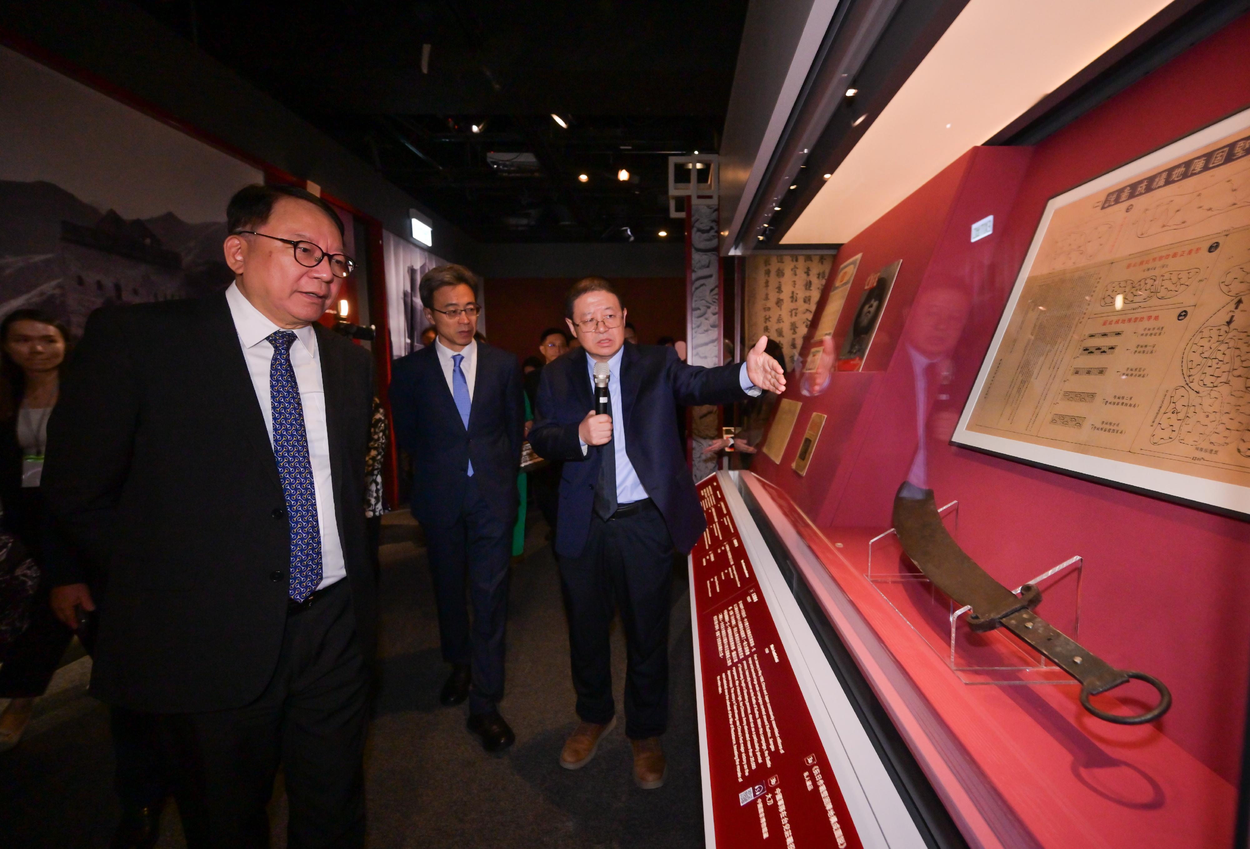 The Chief Secretary for Administration, Mr Chan Kwok-ki, attended the opening ceremony of "The Hong Kong Jockey Club Series: United in Arms, Standing for Peace - 80th Anniversary of Chinese Victory in the War of Resistance Exhibition" today (August 26). Photo shows Mr Chan Kwok-ki (first left) touring the exhibition.