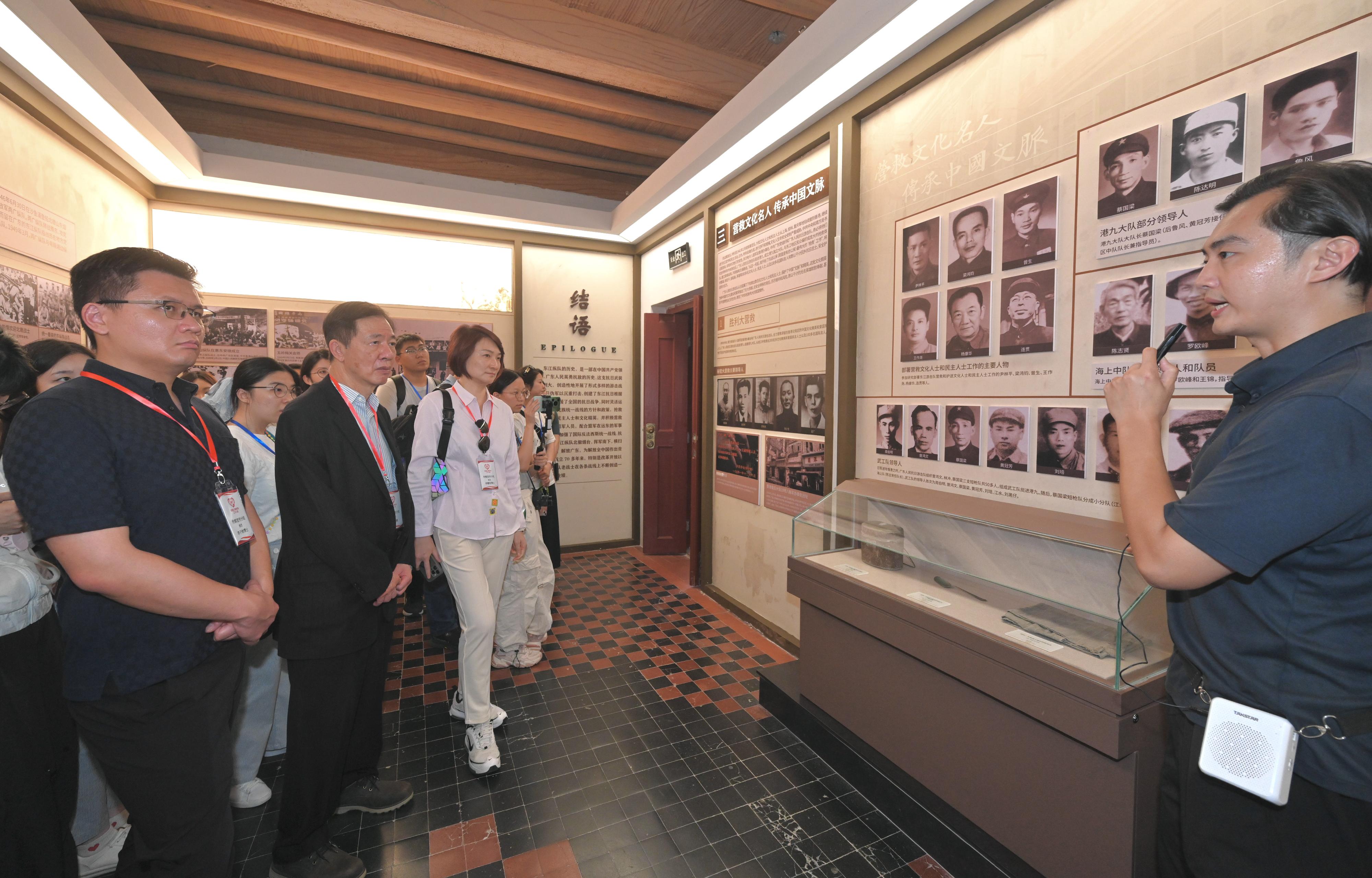 The Working Group on Patriotic Education under the Constitution and Basic Law Promotion Steering Committee organised a two-day study tour themed around the 80th Anniversary of Victory in Chinese People's War of Resistance against Japanese Aggression and the World Anti-Fascist War yesterday (August 27) and today (August 28) to visit various historical sites and museums in Shenzhen, Dongguan and Guangzhou, with a focus on patriotic devotion to the Chinese nation, gaining a deeper understanding of the gallant efforts of the war martyrs. Photo shows the delegation visiting the former headquarters of the Dongjiang Column in Tuyang village.
