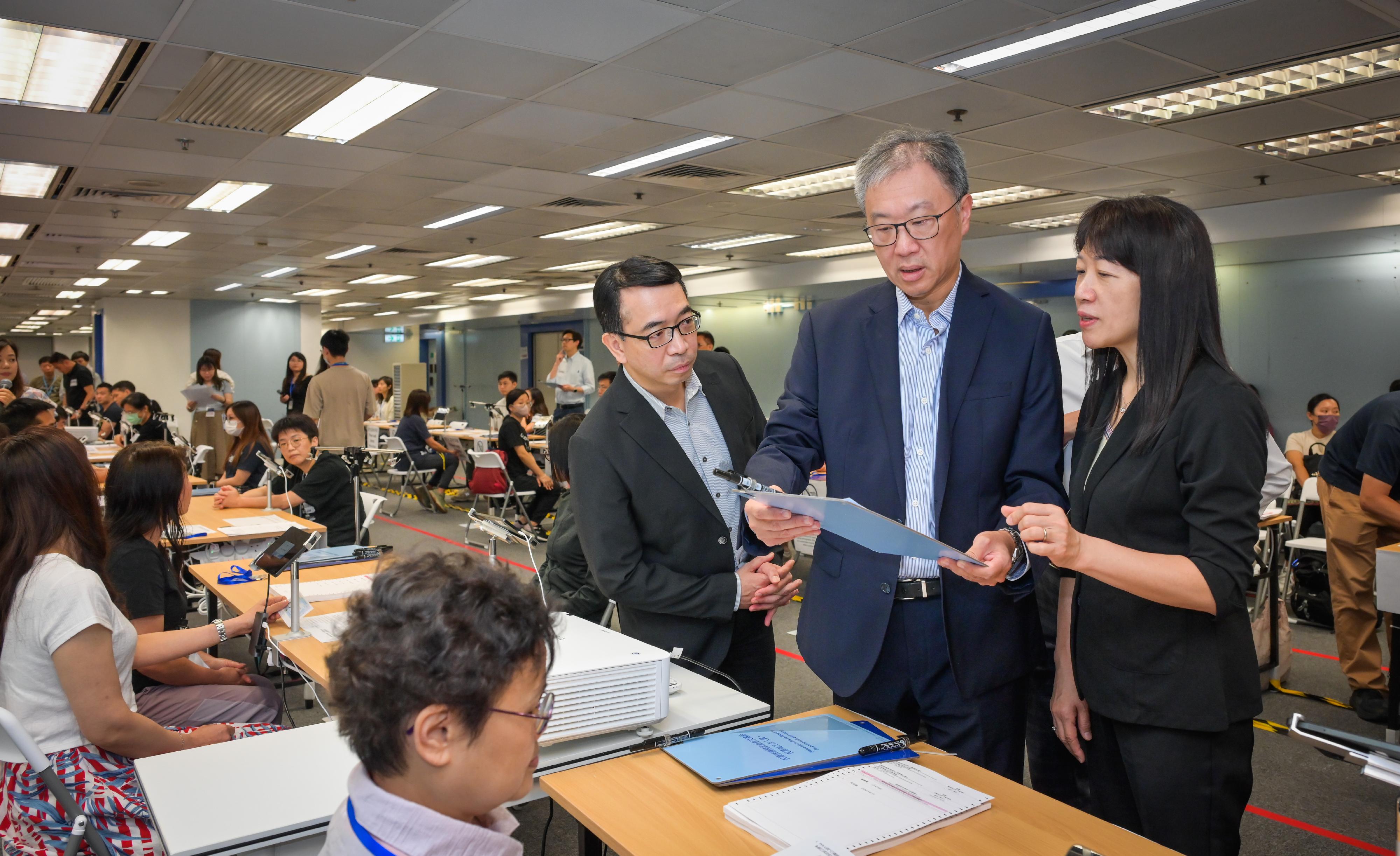 The 2025 Election Committee Subsector By-elections will be held on September 7 (Sunday). The Chairman of the Electoral Affairs Commission, Mr Justice David Lok (centre), accompanied by the Chief Electoral Officer of the Registration and Electoral Office (REO), Ms Natalie Chan (right), and the Principal Electoral Officer (Elections) of the REO, Mr Raymond Chan (left), today (August 28) inspected the hands-on training session organised by the REO for the electoral staff of polling stations, including the operation of the Electronic Poll Register System and contingency measures for special situations to get them well prepared for the By-elections.