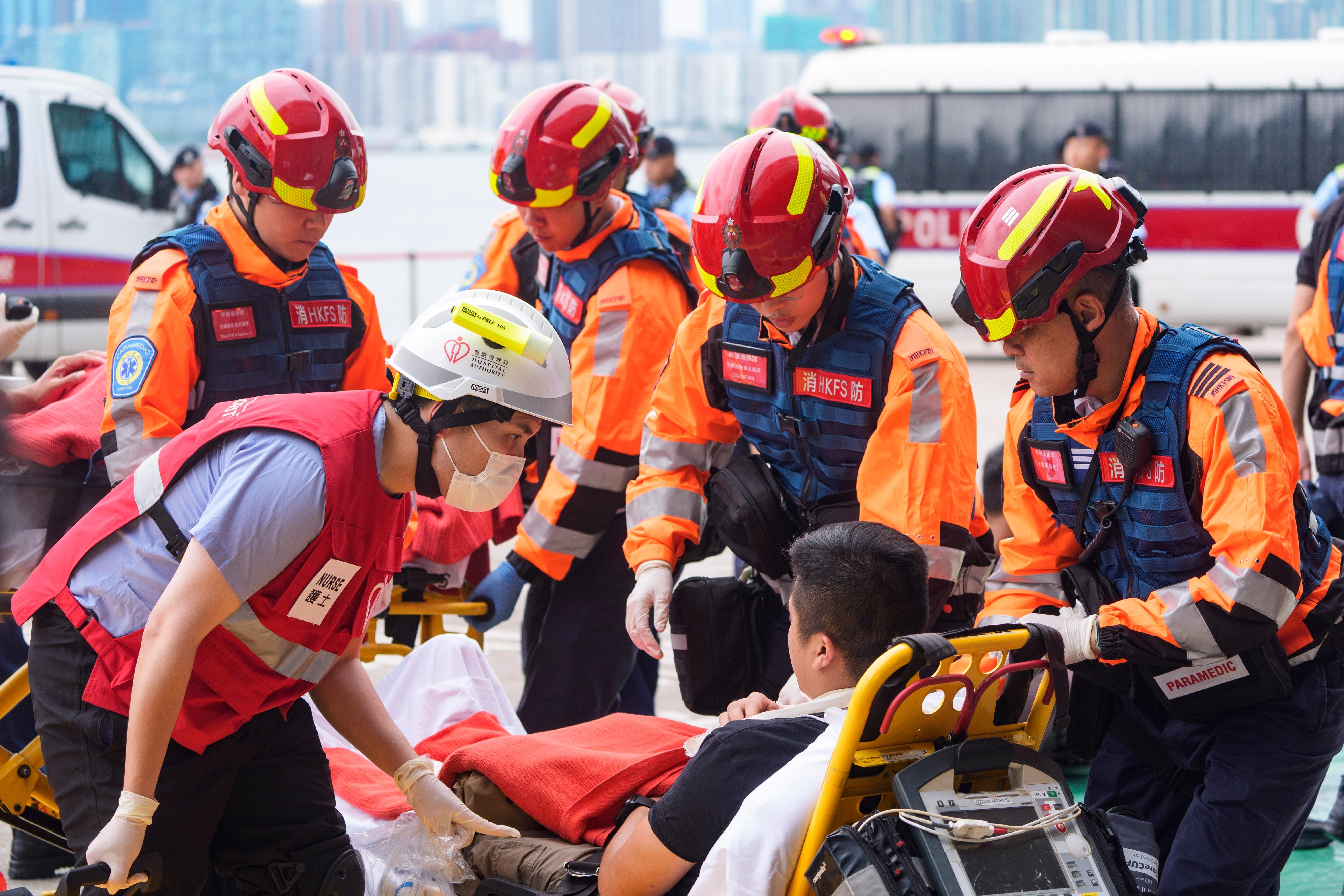 The Inter-departmental Counter Terrorism Unit conducted a large-scale interdepartmental counter-terrorism exercise codenamed BRAVELIGHT at the Kai Tak Cruise Terminal today (August 28). Photo shows ambulance personnel of the Fire Services Department and healthcare personnel of the Hospital Authority performing triage and initial treatment for the casualties.