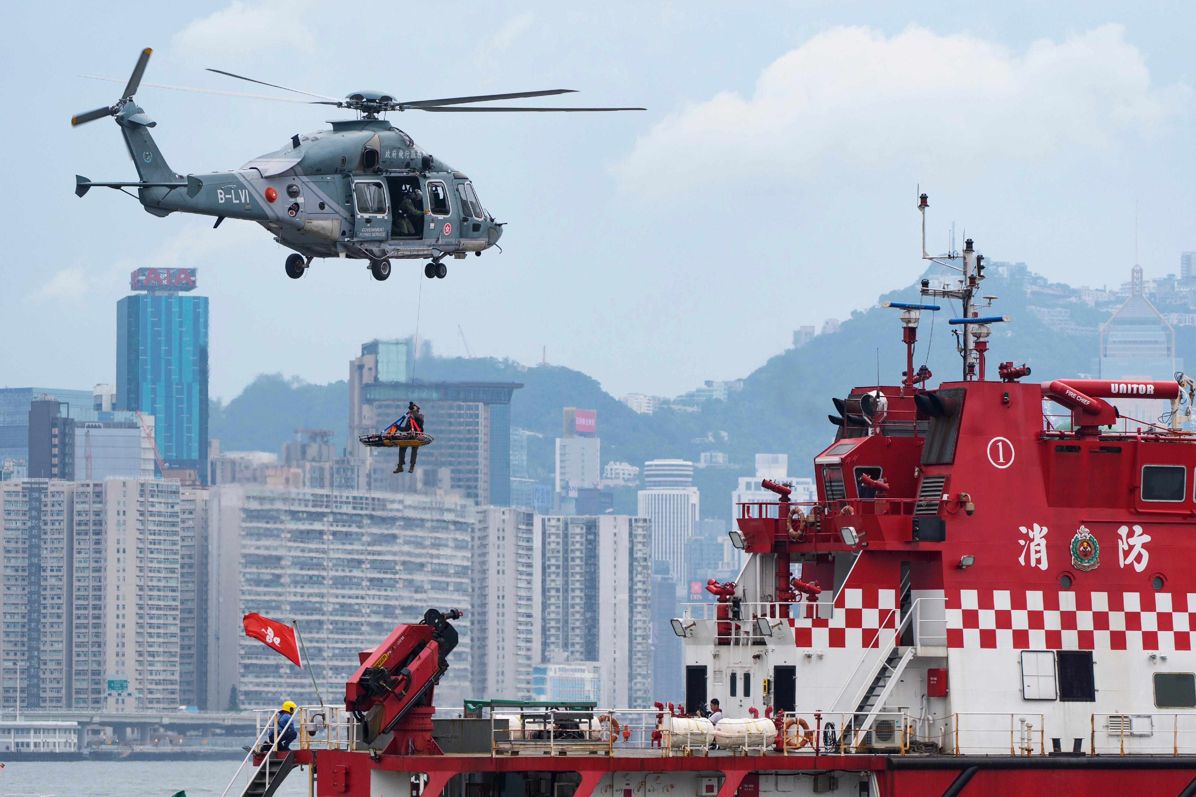 The Inter-departmental Counter Terrorism Unit conducted a large-scale interdepartmental counter-terrorism exercise codenamed BRAVELIGHT at the Kai Tak Cruise Terminal today (August 28). Photo shows the Government Flying Service providing aerial support with a helicopter.