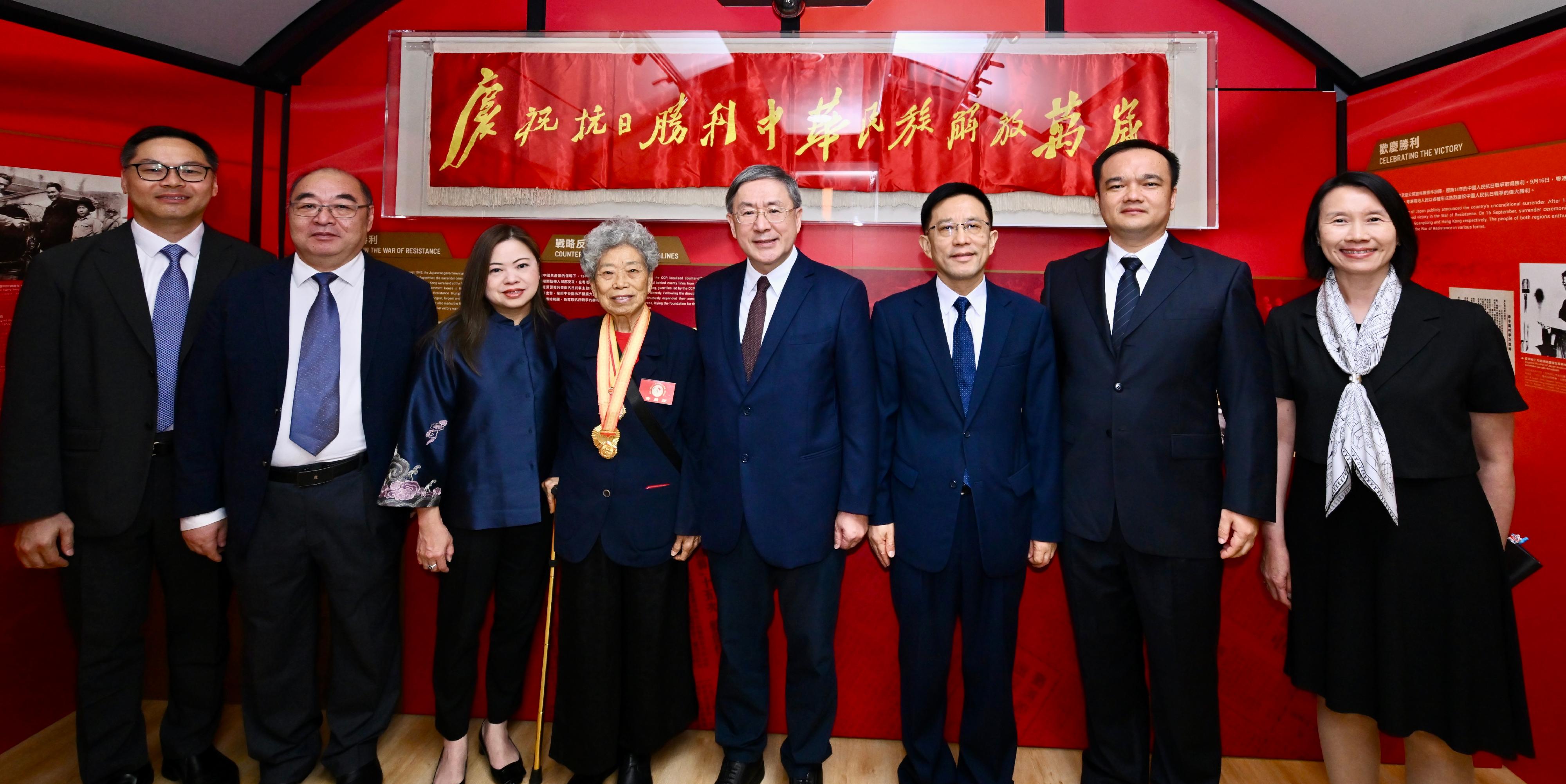 The "Standing Together for Peacebuilding: Commemorating the 80th Anniversary of Victory in the War of Resistance in Guangdong and Hong Kong" exhibition will be staged at the Hong Kong Museum of the War of Resistance and Coastal Defence from tomorrow (August 29) to July 8, 2026. Photo shows (from left) the Head of the Chinese Culture Promotion Office, Mr Terence Cheung; the Director of the Guangzhou Municipal Bureau of Cultural Relics cum Deputy Director of the Guangzhou Municipal Culture, Radio, Television and Tourism Bureau, Mr Liu Xiaoming; the Secretary for Culture, Sports and Tourism, Miss Rosanna Law; the President of the Society of Veterans of the Original Hong Kong Independent Battalion of the Dongjiang Column, Ms Lam Chun; the Deputy Chief Secretary for Administration, Mr Cheuk Wing-hing; the Secretary General of the Liaison Office of the Central People's Government in the Hong Kong Special Administrative Region, Mr Wang Songmiao; the Curator of the Guangdong Museum of Revolutionary History, Mr Yi Xibing; and the Director of Leisure and Cultural Services, Ms Manda Chan, touring at the exhibition gallery after the opening ceremony today (August 28).