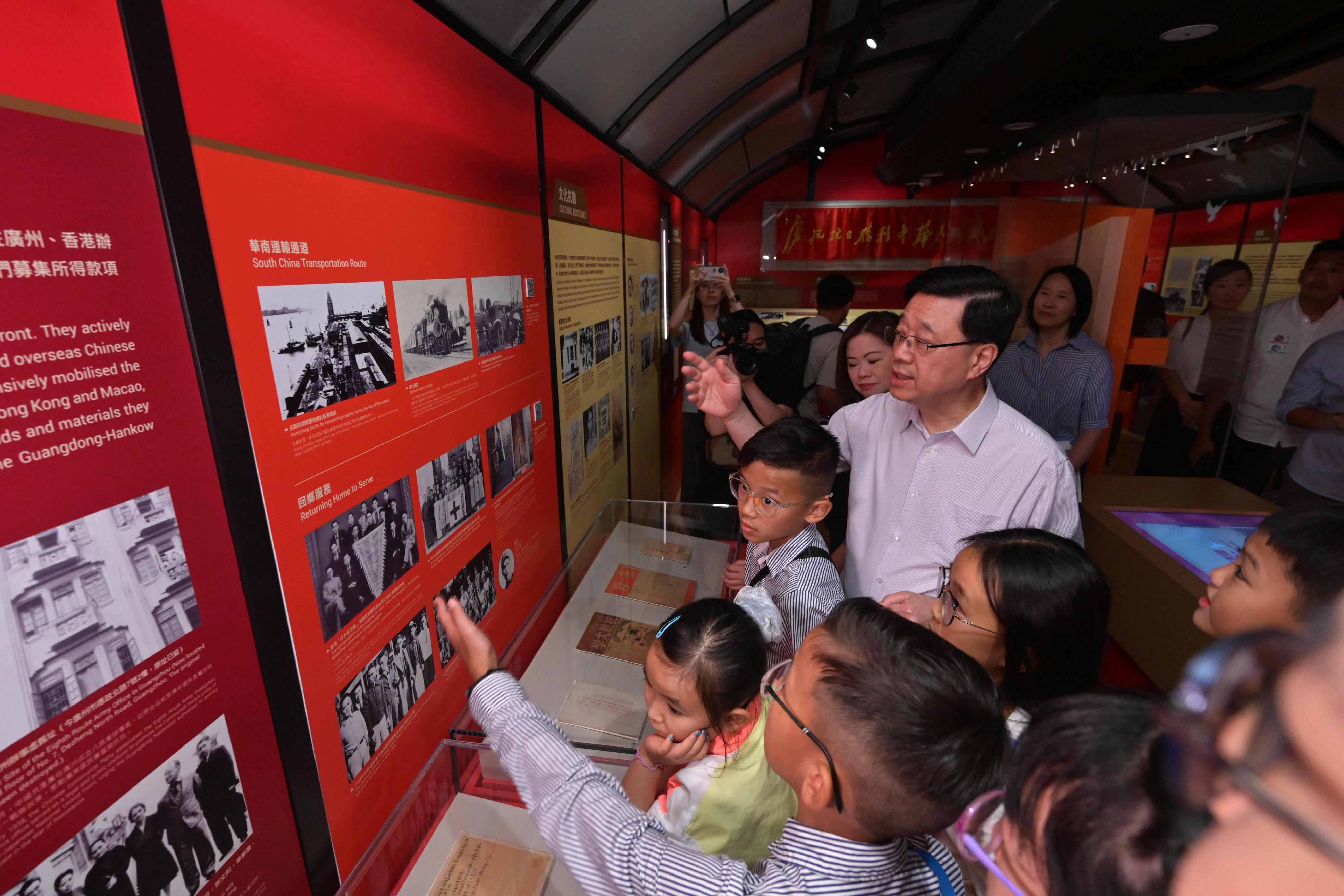 The Chief Executive, Mr John Lee, visited Eastern District today (August 30) to gather public views on the upcoming Policy Address. Photo shows Mr Lee touring the Thematic Gallery of the Hong Kong Museum of the War of Resistance and Coastal Defence and interacting with members of the public on-site.