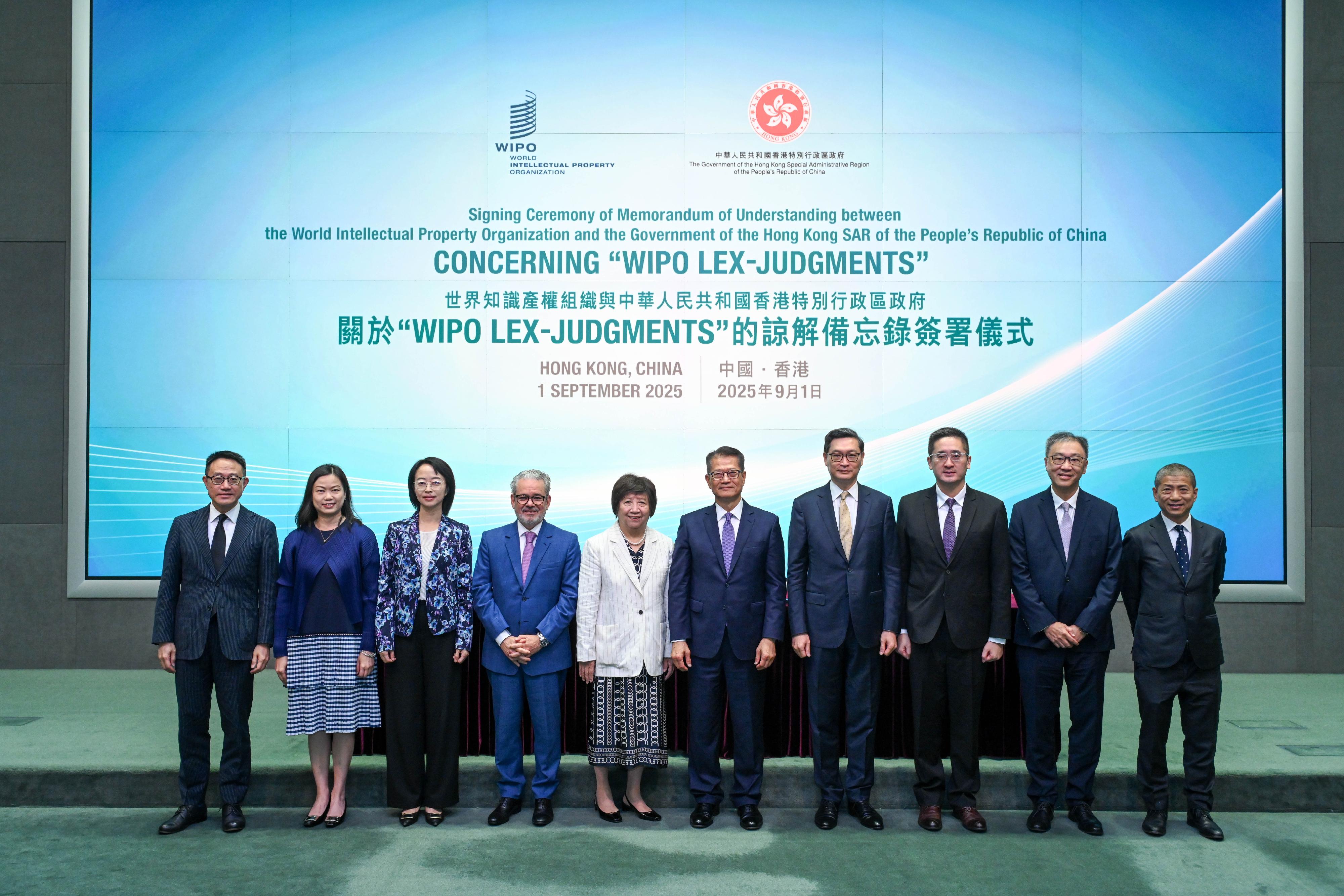 The Hong Kong Special Administrative Region (HKSAR) Government today (September 1) signed a Memorandum of Understanding with the World Intellectual Property Organization (WIPO) on co-operation with regard to the WIPO Lex-Judgments database. Photo shows (from left) the Commissioner of Customs and Excise, Mr Chan Tsz-tat; the Permanent Secretary for Commerce and Economic Development, Ms Maggie Wong; the Director-General of the Department of Treaty and Law of the Office of the Commissioner of the Ministry of Foreign Affairs in the HKSAR, Ms Zhou Qian; Assistant Director General of WIPO Mr Marco Alemán; Deputy Director General of WIPO Ms Wang Binying; the Financial Secretary, Mr Paul Chan; the Chief Judge of the High Court, Mr Justice Jeremy Poon; the Acting Secretary for Commerce and Economic Development, Dr Bernard Chan; Judge of the Court of First Instance of the High Court Mr Justice David Lok; and the Director of Intellectual Property, Mr David Wong, at the signing ceremony.