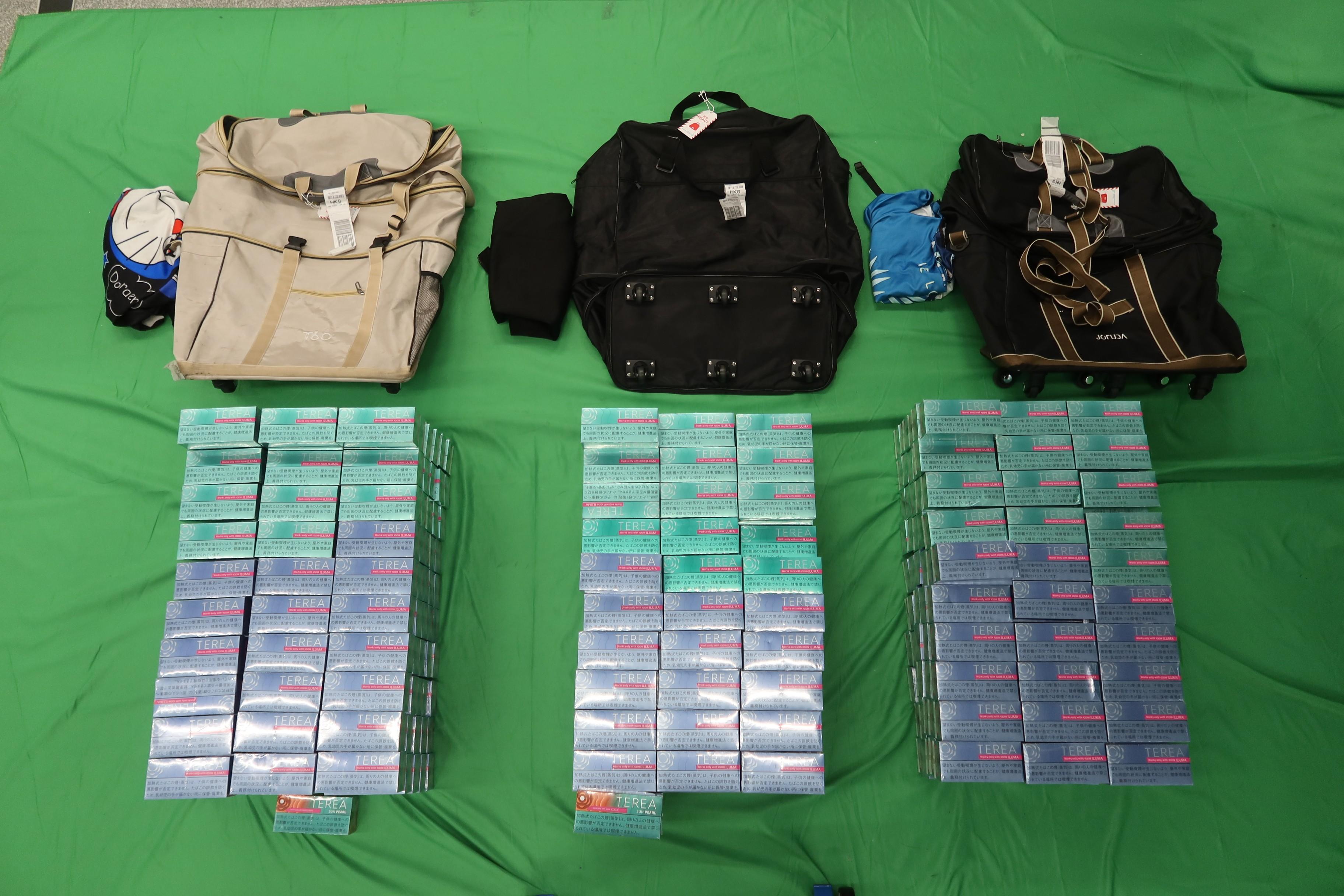 Three incoming passengers were sentenced to six months' imprisonment at the West Kowloon Magistrates' Courts today (September 1) for importing alternative smoking products, in contravention of the Import and Export Ordinance. Photo shows the alternative smoking products seized.