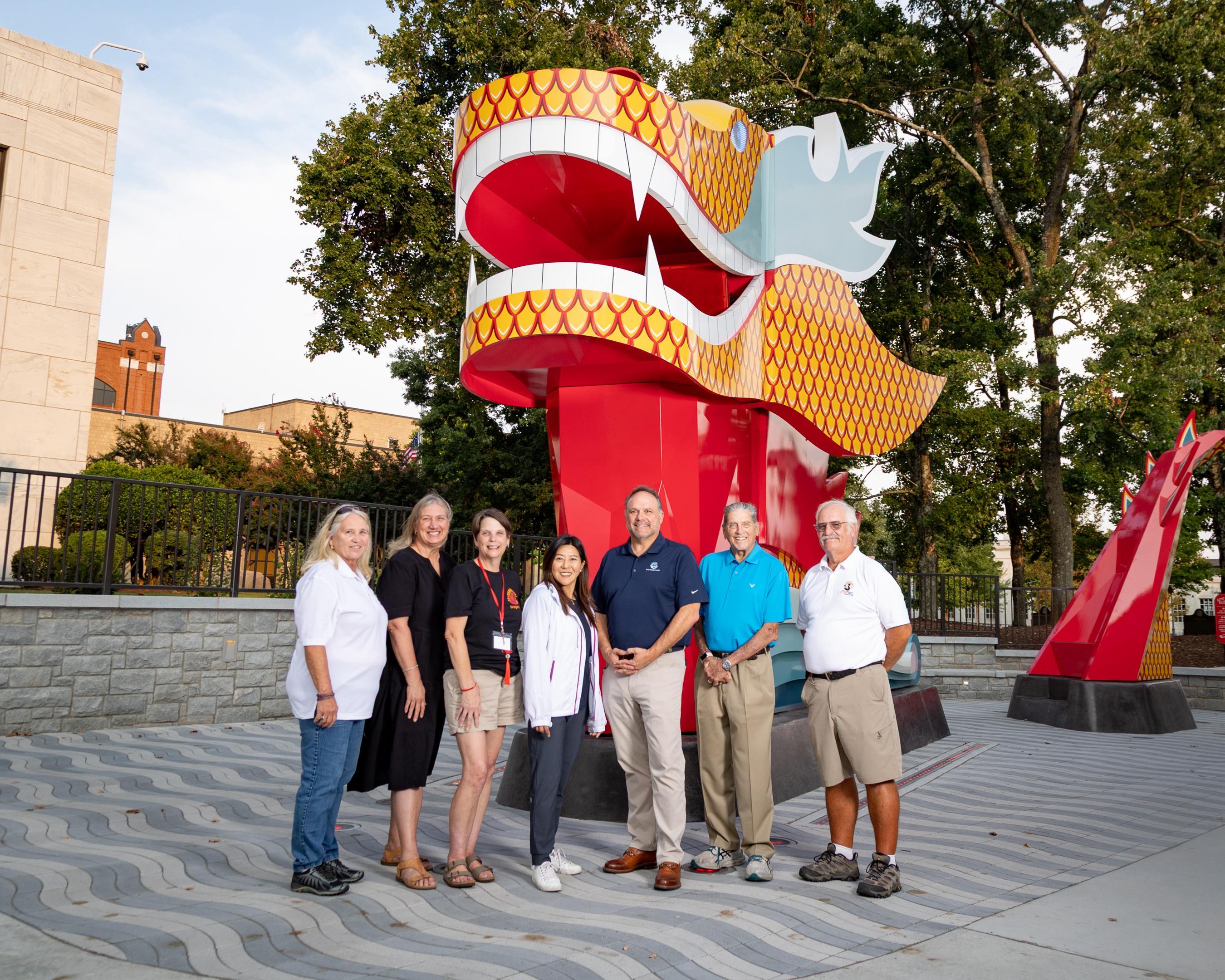 The Director of the Hong Kong Economic and Trade Office, New York, Ms Maisie Ho, visited downtown Gainesville on September 5 (Atlanta time) to view a signature cultural landmark: a striking 14-foot-tall, 30-foot-long interactive dragon art installation, created to honour Gainesville's longstanding role as host of the Atlanta Hong Kong Dragon Boat Festival. Photo shows Ms Ho (centre) with the Mayor of Gainesville, Mr Sam Couvillon (third right) and other guests at the cultural landmark.