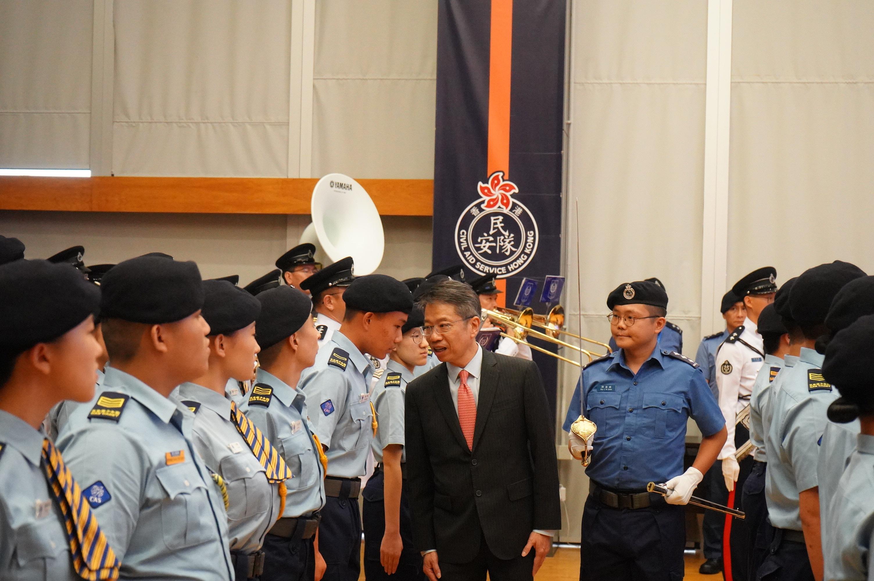The Civil Aid Service (CAS) Cadet Corps held the Foot Drill Competition 2025 and the Slogan Design Competition in Commemoration of the 80th Anniversary of Victory in the Chinese People's War of Resistance Against Japanese Aggression today (September 7) at the CAS Headquarters. Photo shows the Permanent Secretary for the Civil Service, Mr Clement Leung (second right), reviewing the teams participating in the competition.
