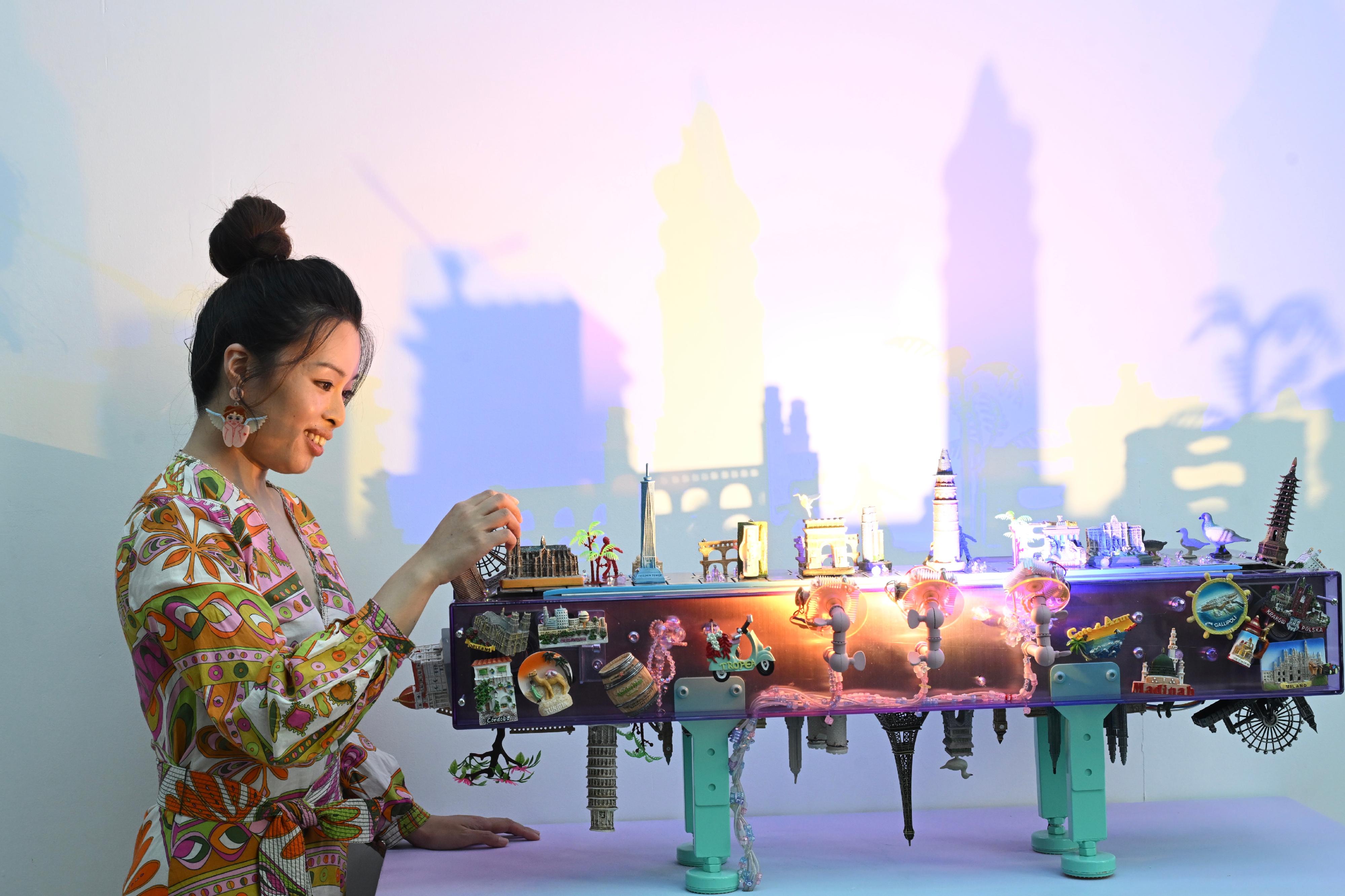 The Hong Kong Visual Arts Centre is staging the new exhibition "Mirage" from today (September 10), featuring two sets of new installation works created by Hong Kong artist Angela Yuen. Photo shows Yuen and her artwork "City Styling Manual".