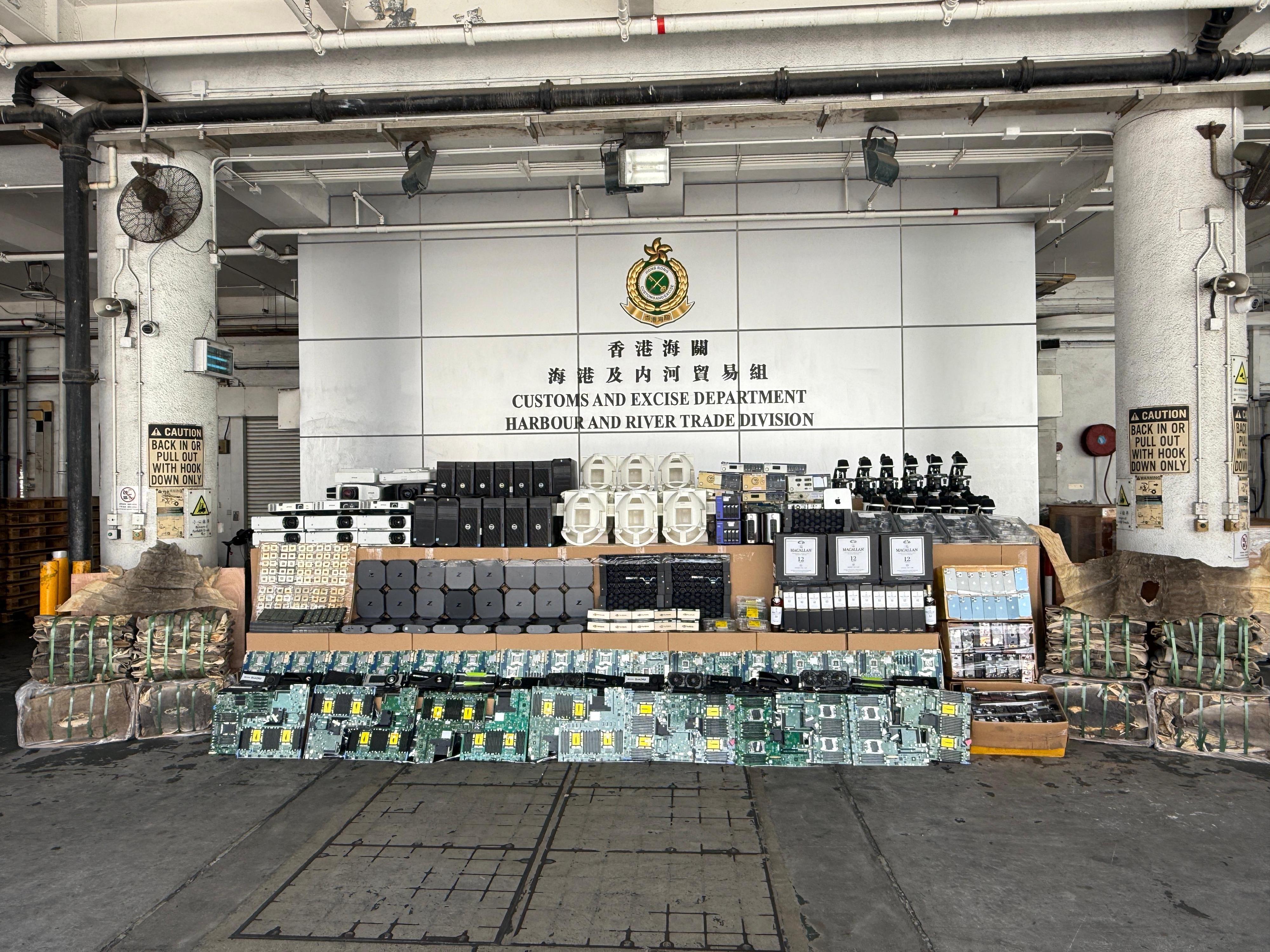 Hong Kong Customs on August 26 detected a suspected case of using an ocean-going vessel to smuggle goods to Korea at the Kwai Chung Container Terminals. A large batch of suspected unmanifested goods, including suspected scheduled shark skin, electronic goods and parts, and liquor, with an estimated market value of about $140 million was seized. Photo shows the suspected unmanifested goods seized.


