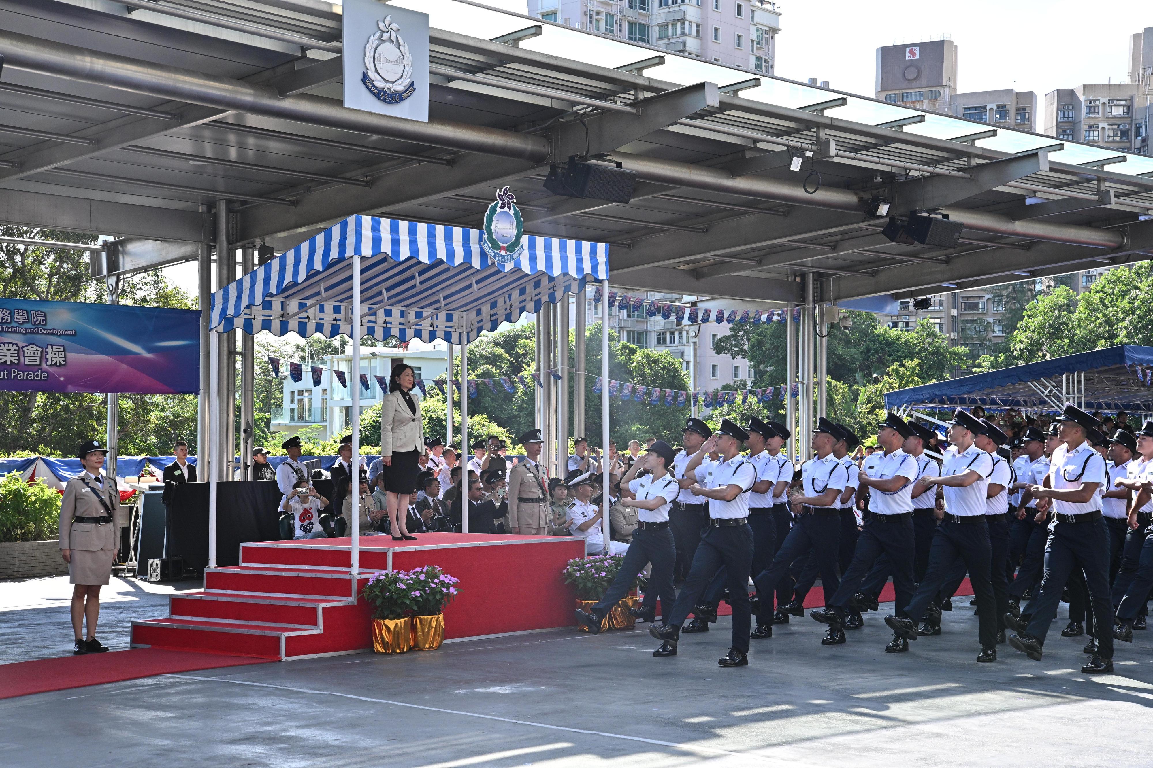 The Immigration Service Institute of Training and Development passing-out parade was held today (September 11). Photo shows passing-out officers marching in step past the dais in Chinese-style foot drill.