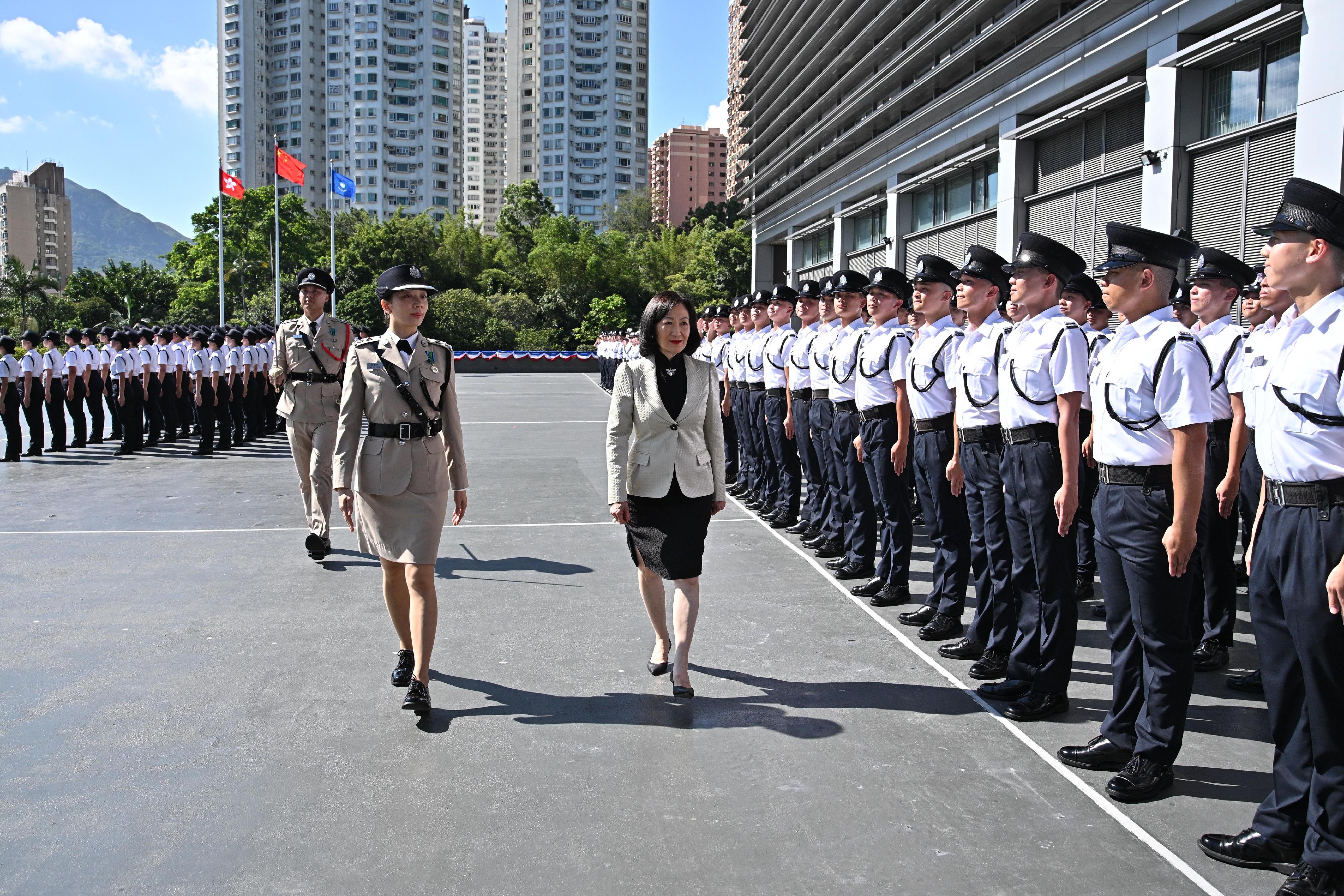 The Convenor of the Non-official Members of the Executive Council, Mrs Regina Ip, inspects a contingent of graduates at the Immigration Service Institute of Training and Development passing-out parade today (September 11).