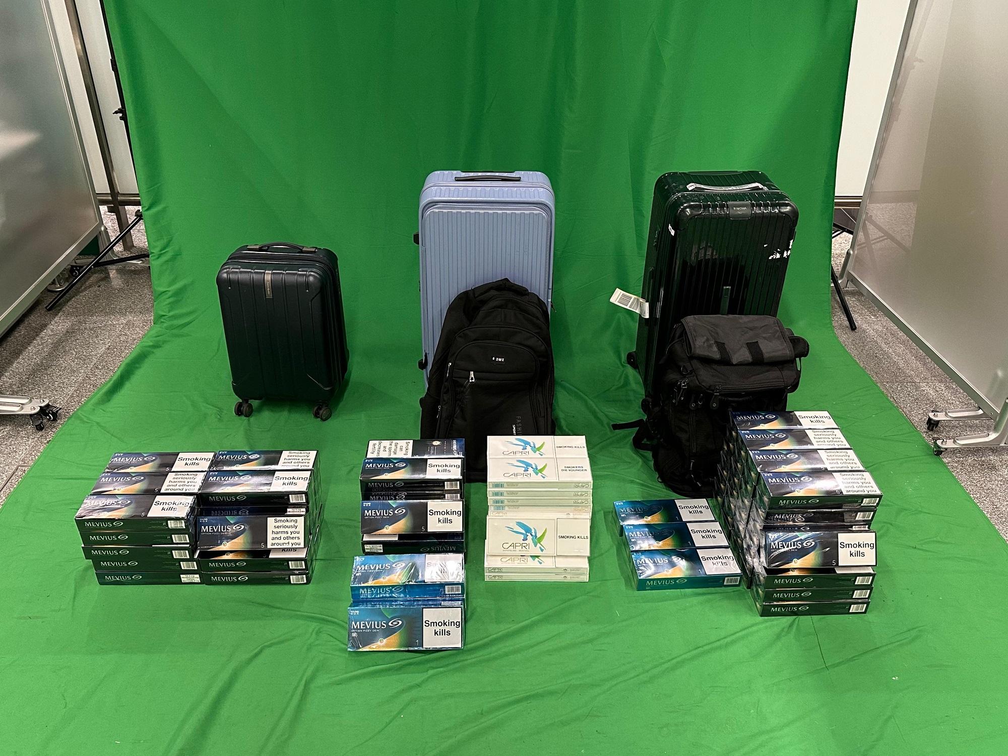 A 48-year-old incoming male passenger was sentenced to five months' imprisonment with a fine of $2,000 at the West Kowloon Magistrates' Courts today (September 11) for dealing with and importing duty-not-paid cigarettes, and failing to declare them to Customs officers, in contravention of the Dutiable Commodities Ordinance. Photo shows the duty-not-paid cigarettes seized.
