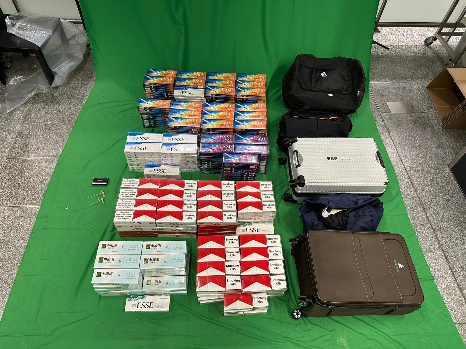 A 31-year-old incoming male passenger was sentenced to nine months' imprisonment with a fine of $1,500 at the West Kowloon Magistrates' Courts today (September 11) for dealing with and importing duty-not-paid cigarettes, and failing to declare them to Customs officers, in contravention of the Dutiable Commodities Ordinance. Photo shows the duty-not-paid cigarettes seized.