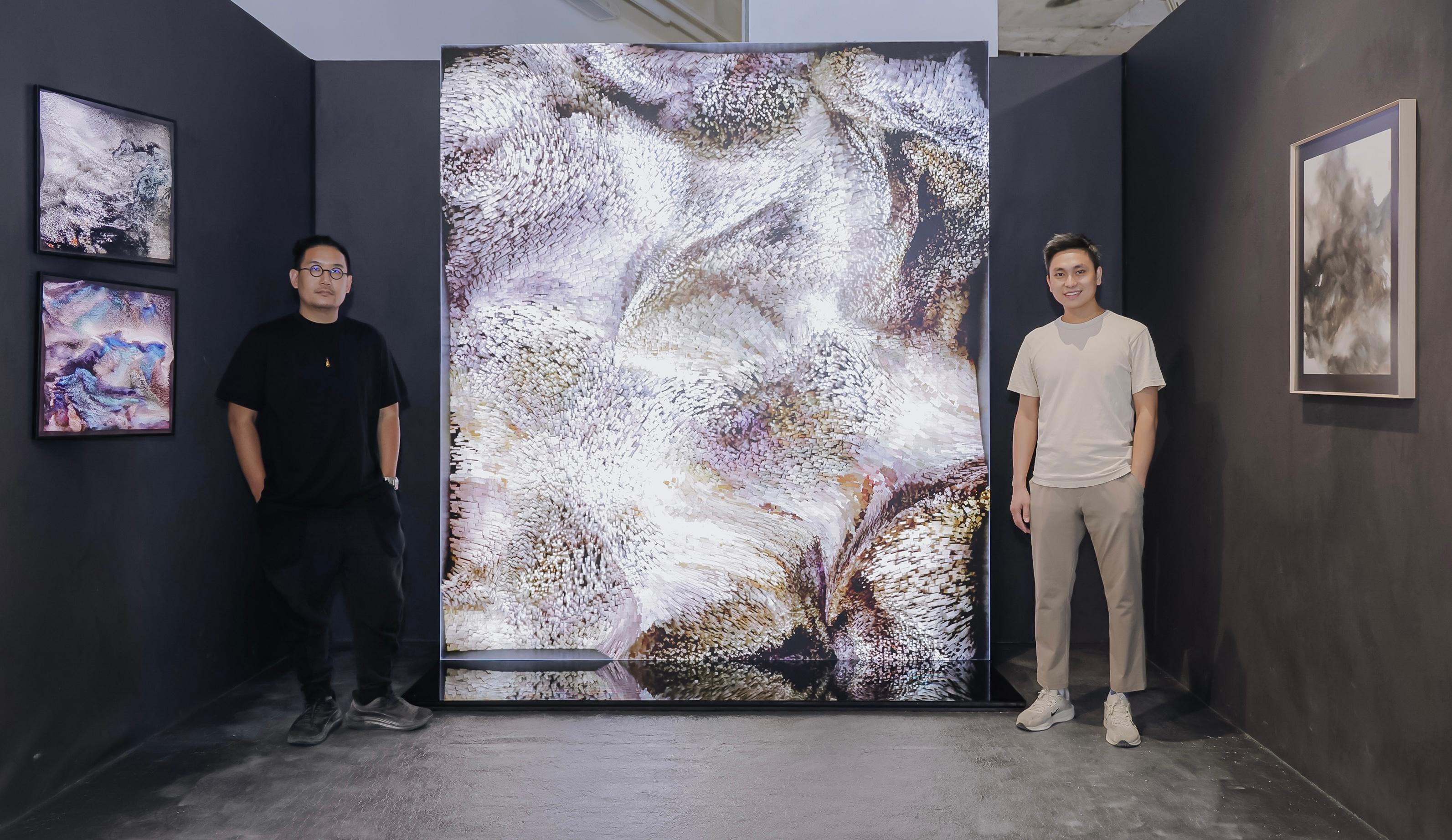 Jointly organised by the Art Promotion Office and the Shenzhen Fringe Art Center, the third exhibition "Strata and Symbiosis" of the "Ink Art Ensembles" Exhibition Series in the Greater Bay Area (GBA) is on display from today (September 12) to October 26 at chi K11 art space in Guangzhou. Photo shows Hong Kong artist Ross Yau (right), Cao Yuxi (left) from another GBA art group _.WAV_Studio, and their co-creation "Shanshui by AI - A Special Collaboration with Ross YAU Wing Fung" in the centre. On the right side is Yau's "The Trail of the Mountains", and on the left side is _.WAV_Studio_'s "Shanshui by AI".