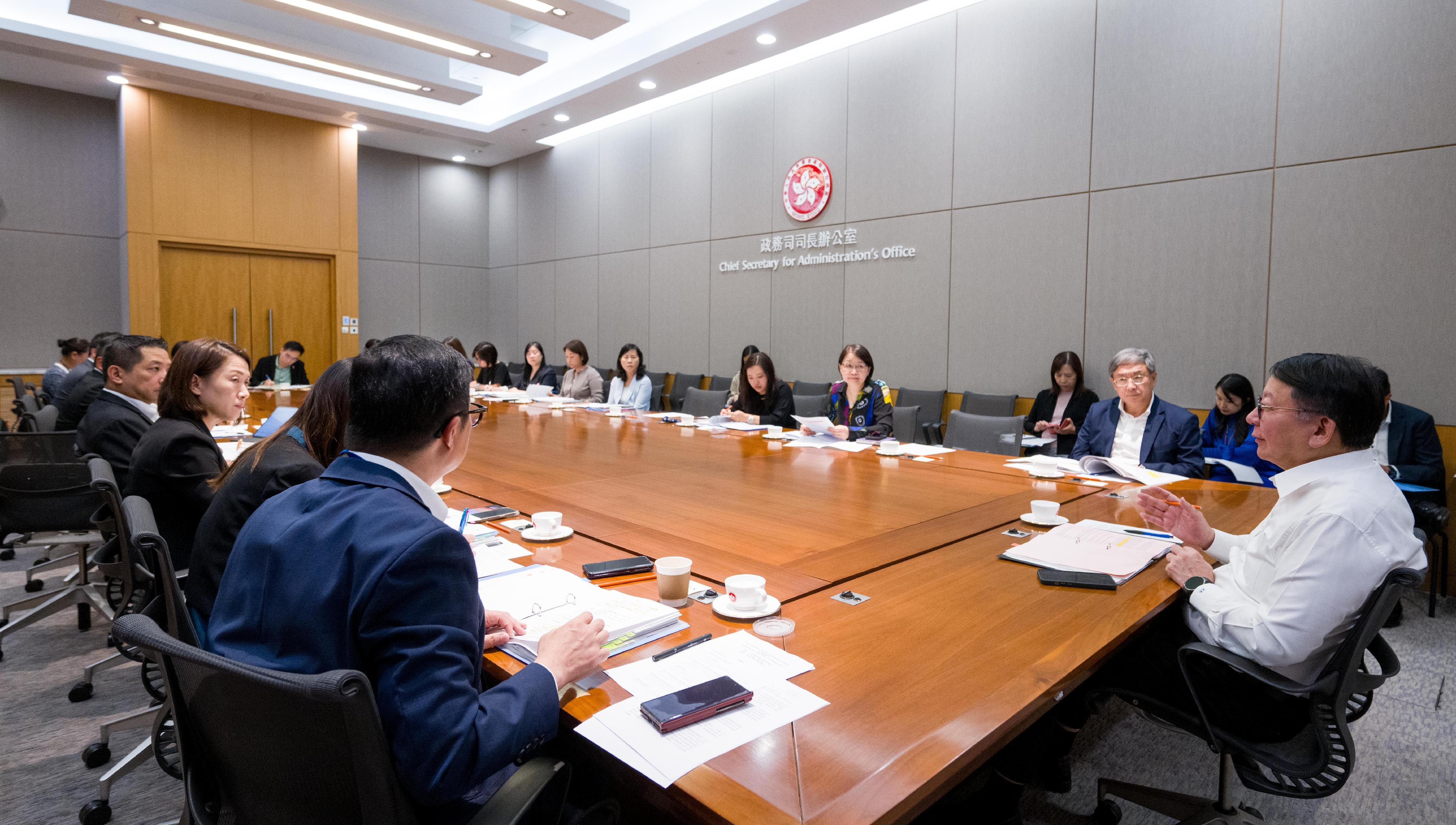 The Chief Secretary for Administration, Mr Chan Kwok-ki (first right), today (September 19) chairs a meeting of the interdepartmental working group on festival arrangements to holistically co-ordinate and steer the preparatory work of various government departments for welcoming visitors to Hong Kong during the National Day Golden Week of the Mainland.