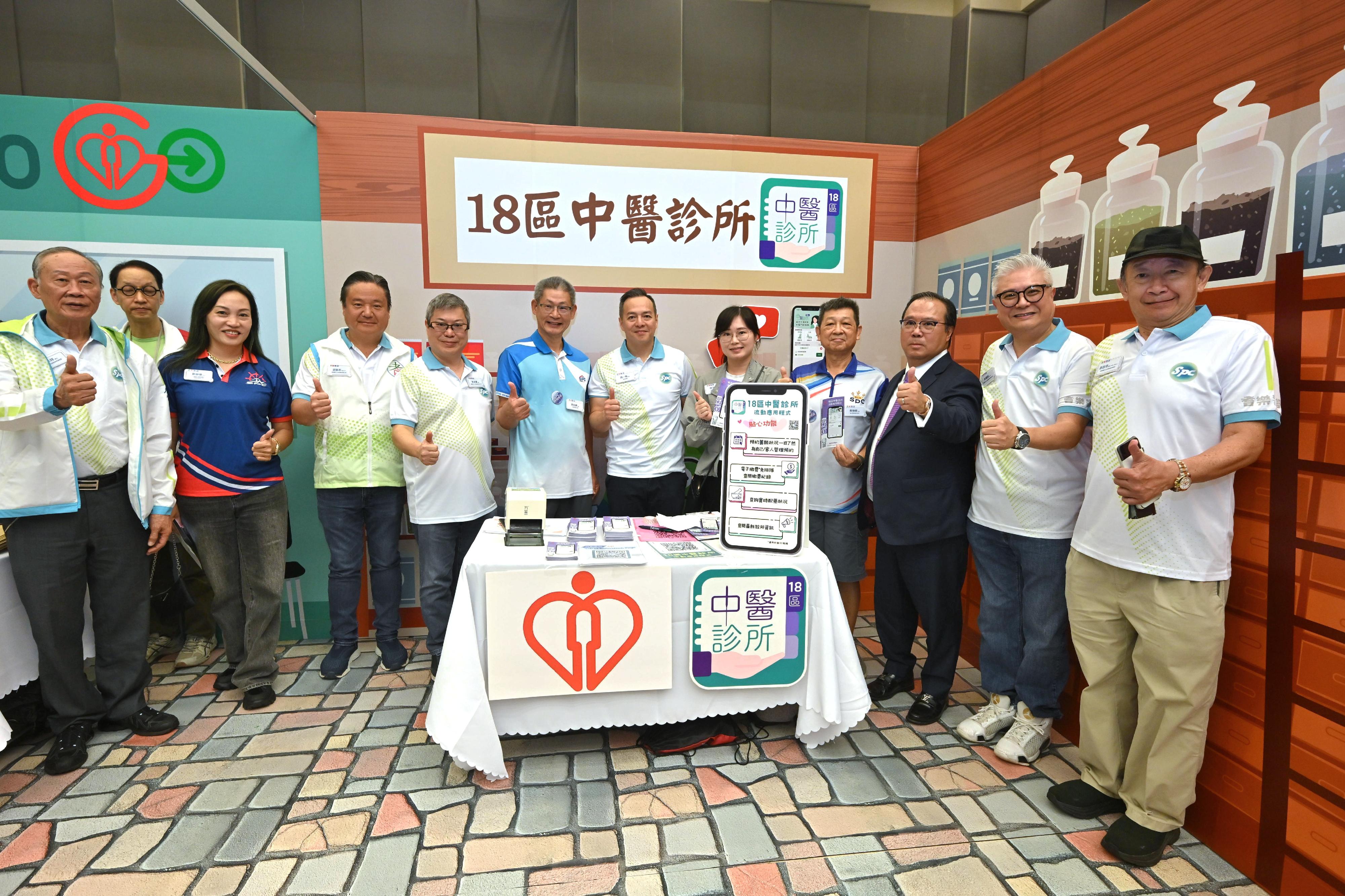 Senior Police Call (SPC) of the Hong Kong Police Force launched the “SPC Share the Love 2025” today (September 20). Photo shows the Commissioner of Police, Mr Chow Yat-ming (sixth right), visiting a booth at the carnival that assists the elderly in mastering the use of practical mobile applications. 