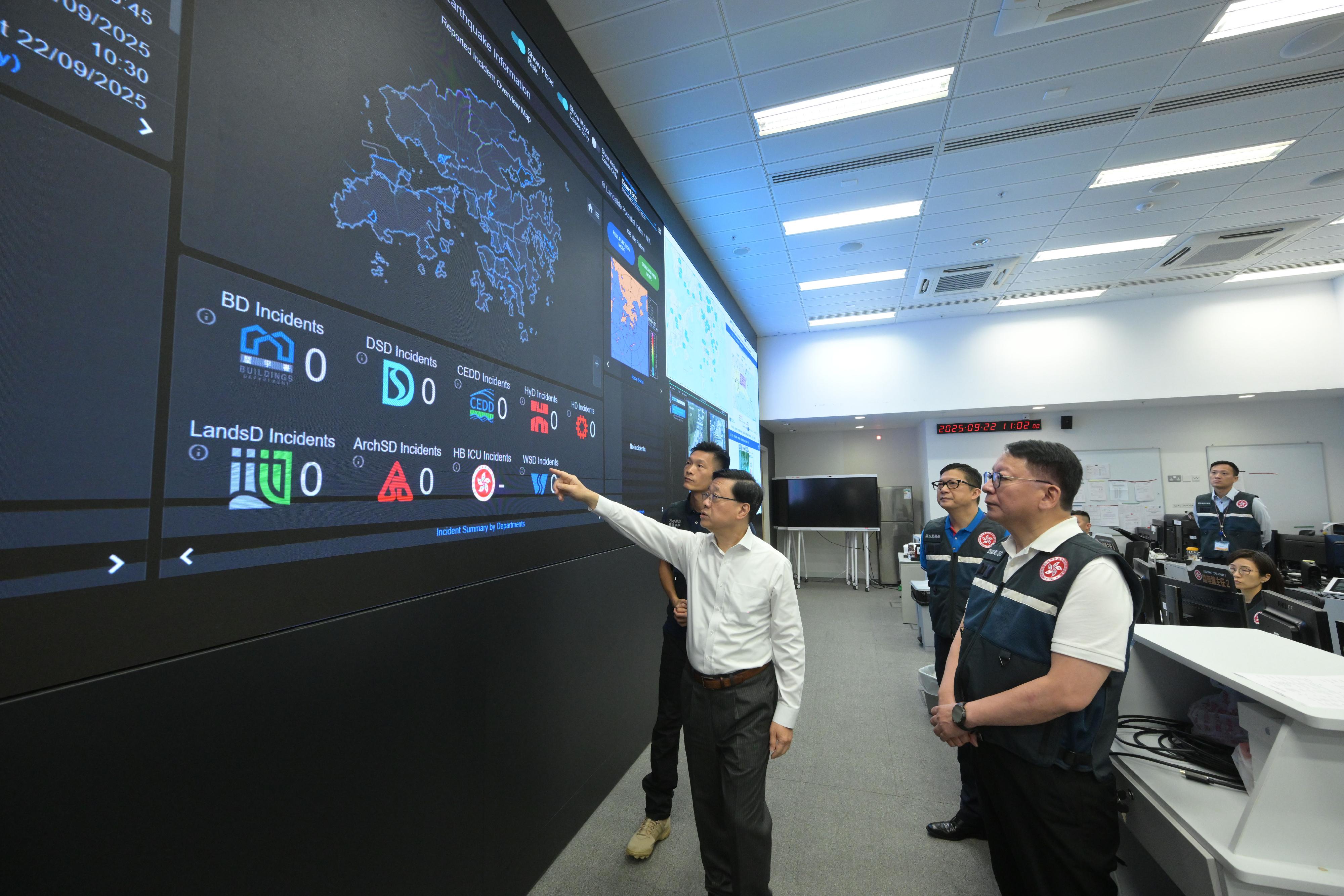 The Chief Executive, Mr John Lee (first left), inspects the operation of the Emergency Monitoring and Support Centre of the Security Bureau today (September 22) to steer the comprehensive and adequate preparations and response efforts across departments to address the possible threats that Super Typhoon Ragasa may pose to Hong Kong. Also pictured are the Chief Secretary for Administration, Mr Chan Kwok-ki (first right), and the Secretary for Security, Mr Tang Ping-keung (second right).