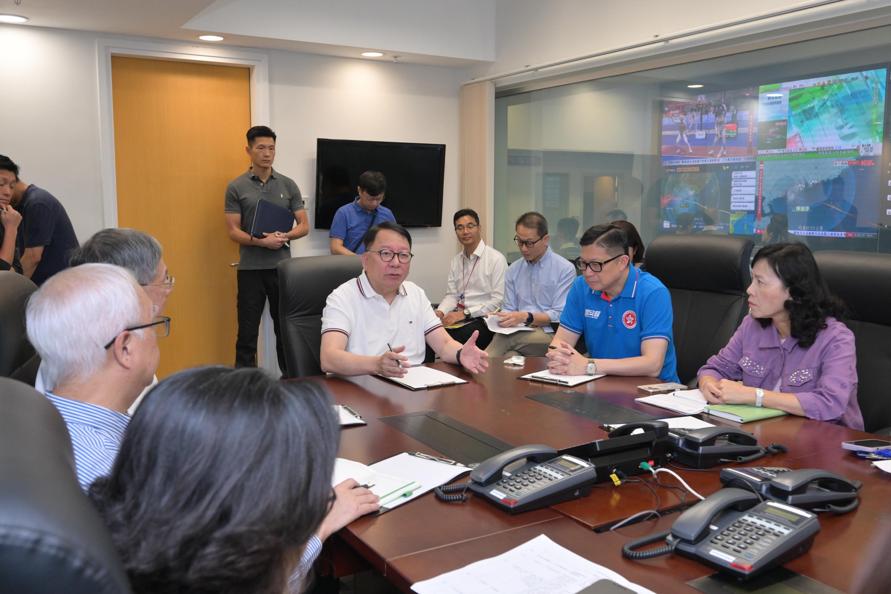 The Chief Secretary for Administration, Mr Chan Kwok-ki (front row, third right), chaired a meeting of the steering committee on handling extreme weather this afternoon (September 24) to receive the latest updates from heads of relevant bureaux and departments and conduct a comprehensive review of the progress in emergency response and recovery efforts in relation to Super Typhoon Ragasa by various government departments.