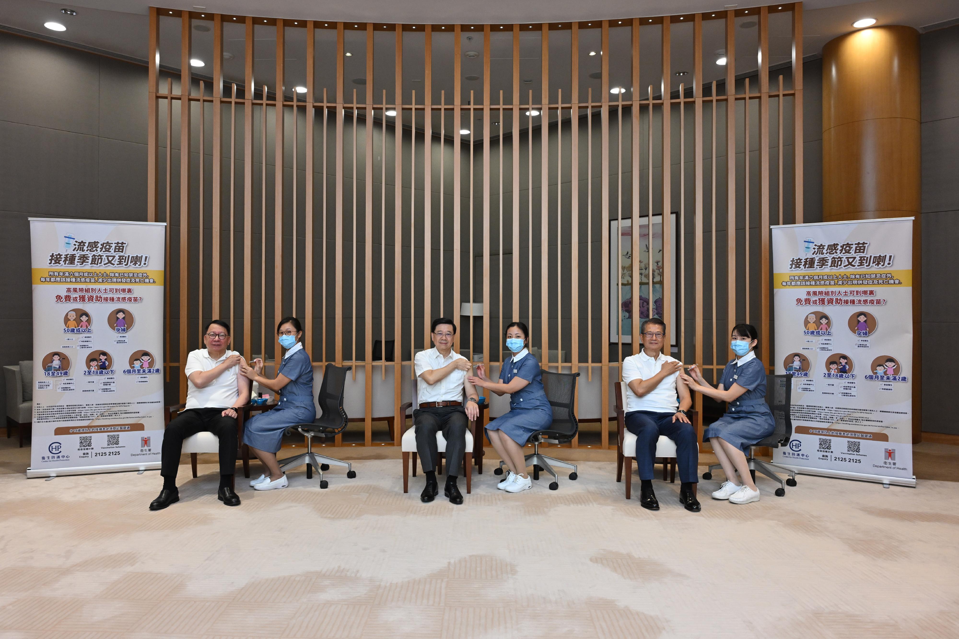 The Chief Executive, Mr John Lee (third left); the Chief Secretary for Administration, Mr Chan Kwok-ki (first left); and the Financial Secretary, Mr Paul Chan (second right), received seasonal influenza vaccination earlier.