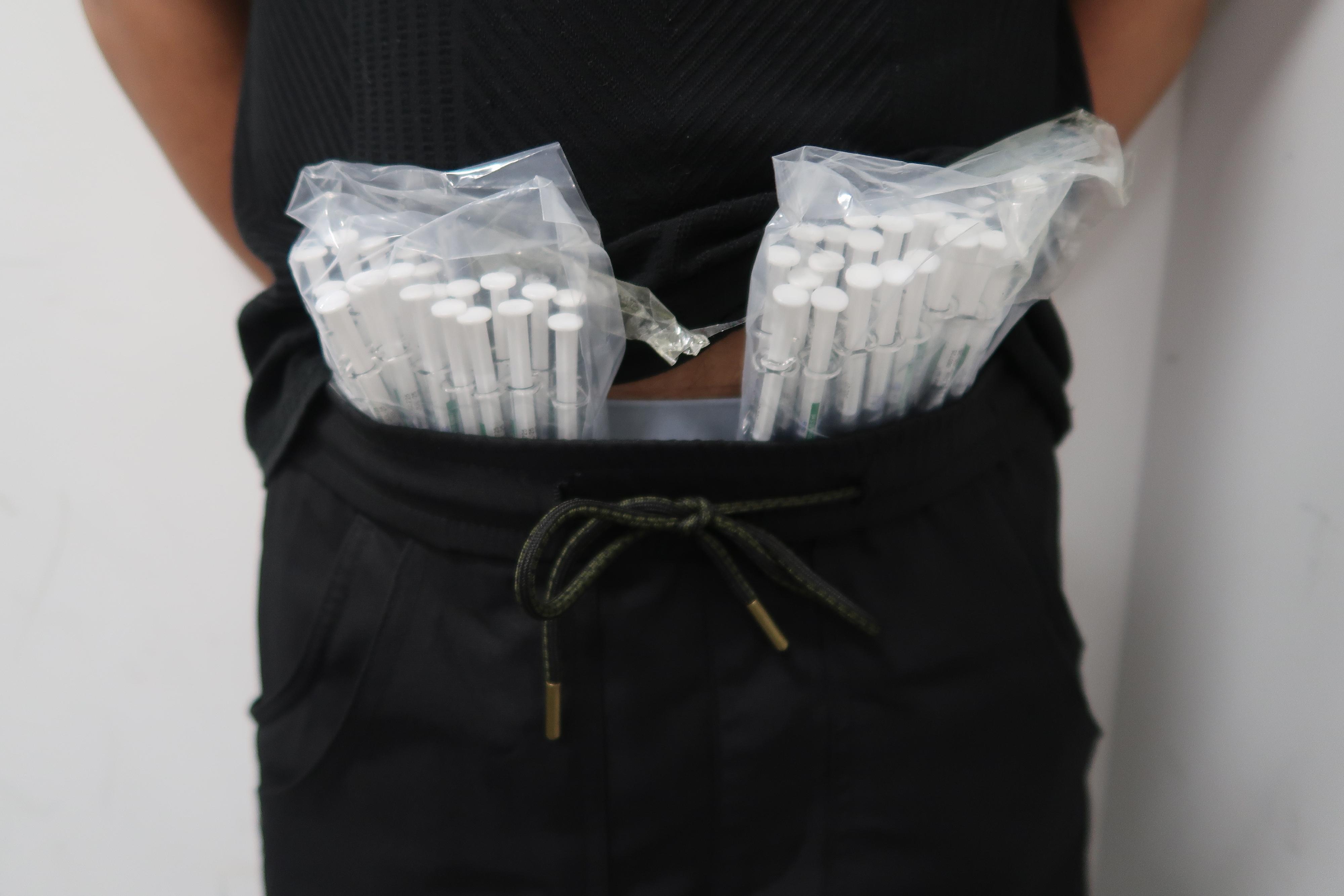Hong Kong Customs detected a smuggling case involving a passenger at the Shenzhen Bay Control Point on August 12 and seized 150 pieces of pharmaceutical injections containing Part I Poisons with an estimated market value of about $80,000. Photo shows some of the pharmaceutical injections concealed around the passenger's waist.