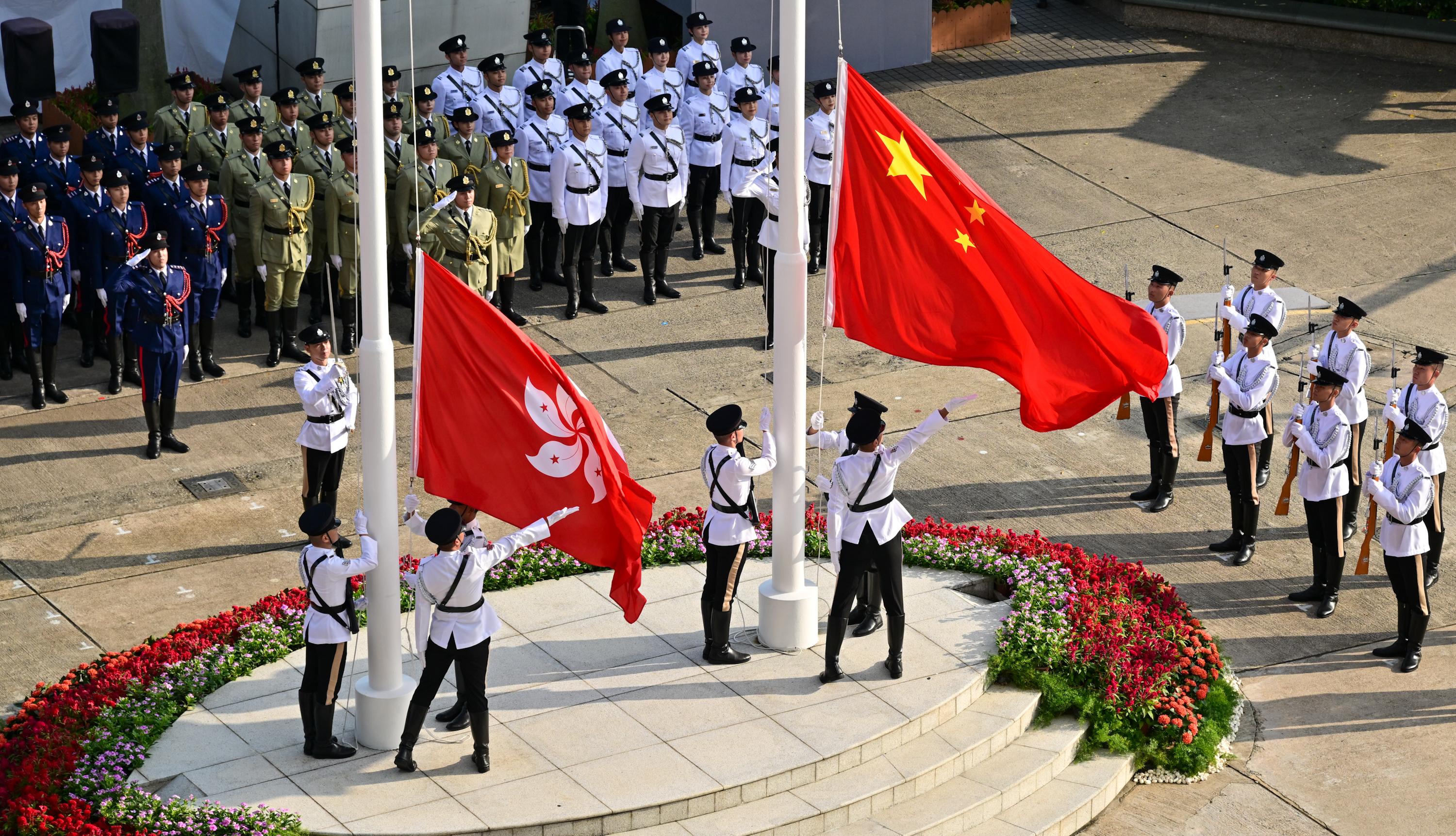 The Chief Executive, Mr John Lee, together with Principal Officials and guests, attends the flag-raising ceremony for the 76th anniversary of the founding of the People's Republic of China at Golden Bauhinia Square in Wan Chai this morning (October 1).