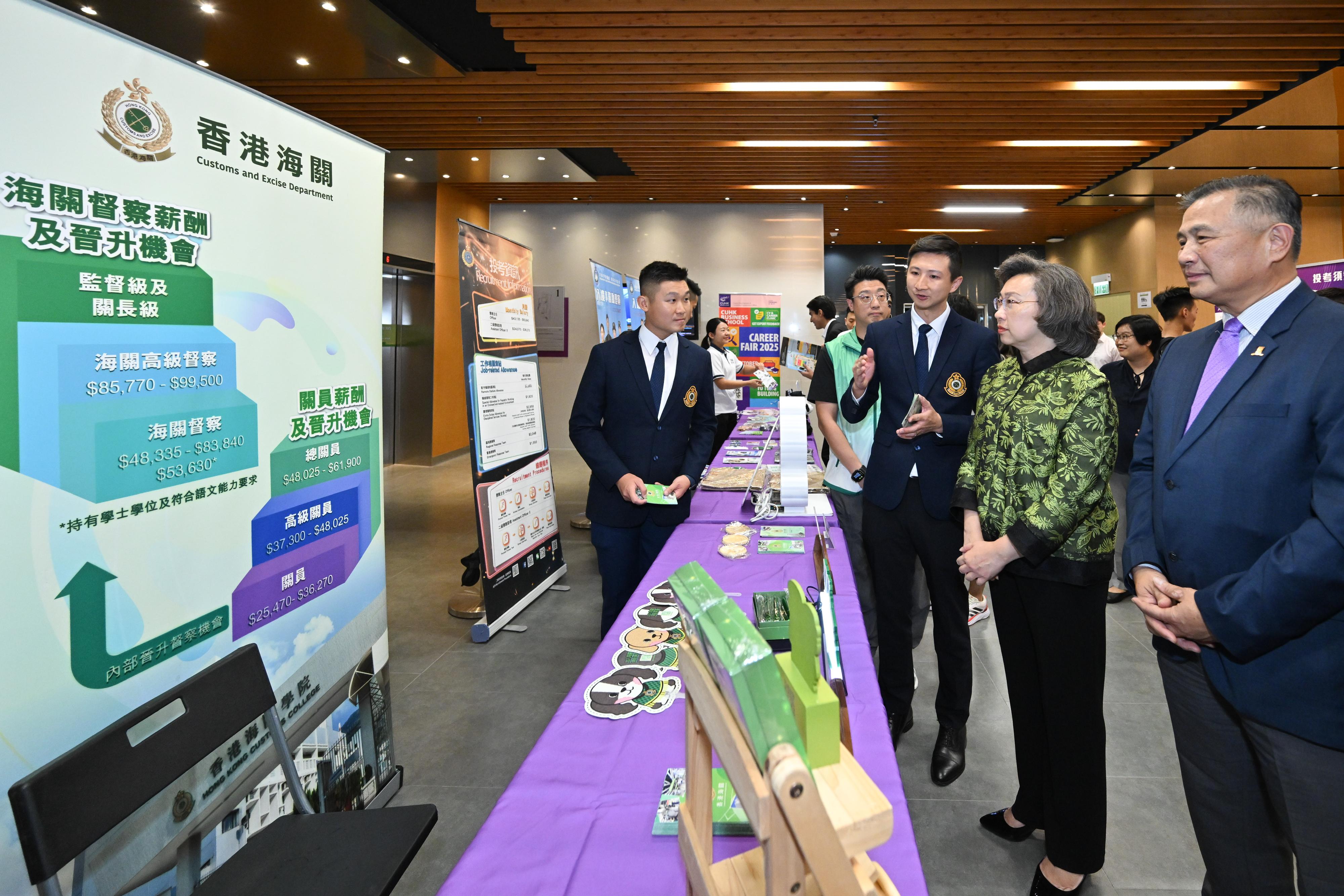 The Secretary for the Civil Service, Mrs Ingrid Yeung, visited the Government Career Fair at the campus of the Chinese University of Hong Kong (CUHK) this afternoon (October 2). Photo shows Mrs Yeung (second right) visiting the Customs and Excise Department (C&ED) booth that provides information about the Inspectorate Grade of the C&ED. Looking on is the Pro-Vice-Chancellor/Vice-President (Education) of the CUHK, Professor Irwin King (first right).