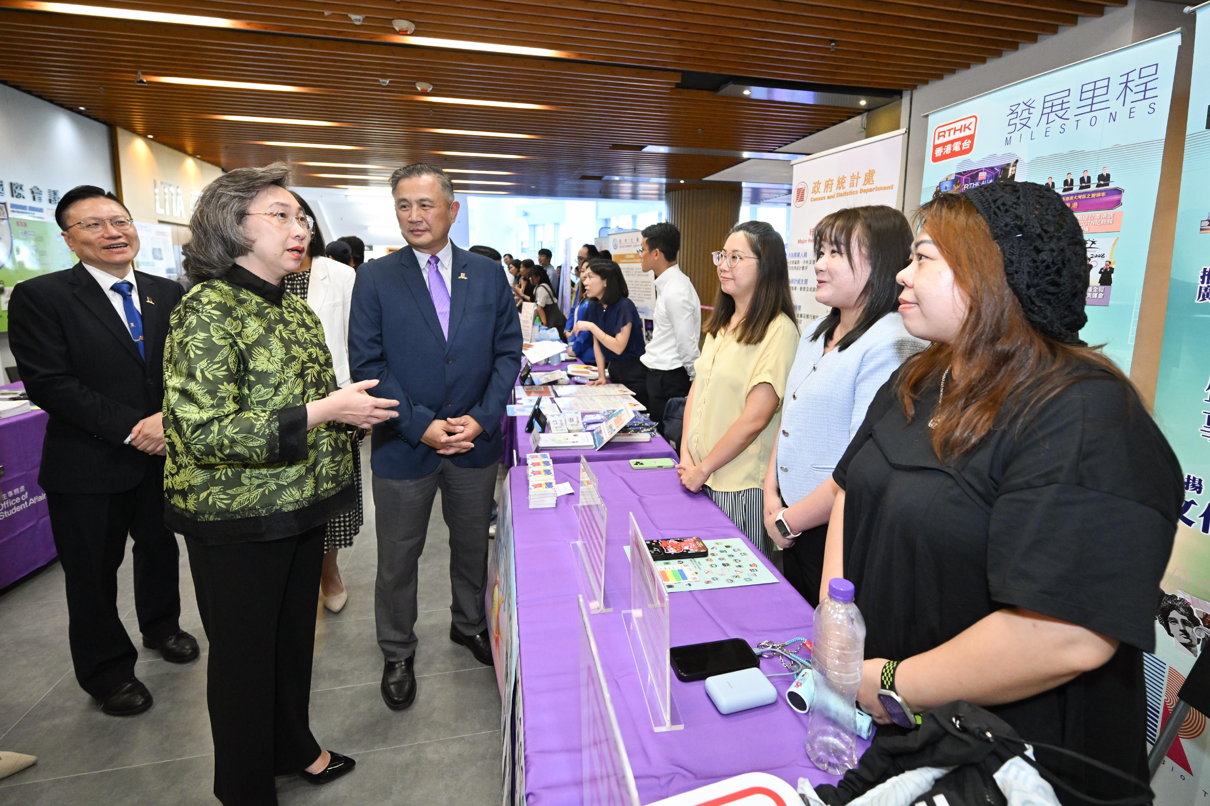 The Secretary for the Civil Service, Mrs Ingrid Yeung, visited the Government Career Fair at the campus of the Chinese University of Hong Kong (CUHK) this afternoon (October 2). Photo shows Mrs Yeung (second left) visiting the Radio Television Hong Kong booth. Looking on is the Pro-Vice-Chancellor/Vice-President (Education) of the CUHK, Professor Irwin King (third left).