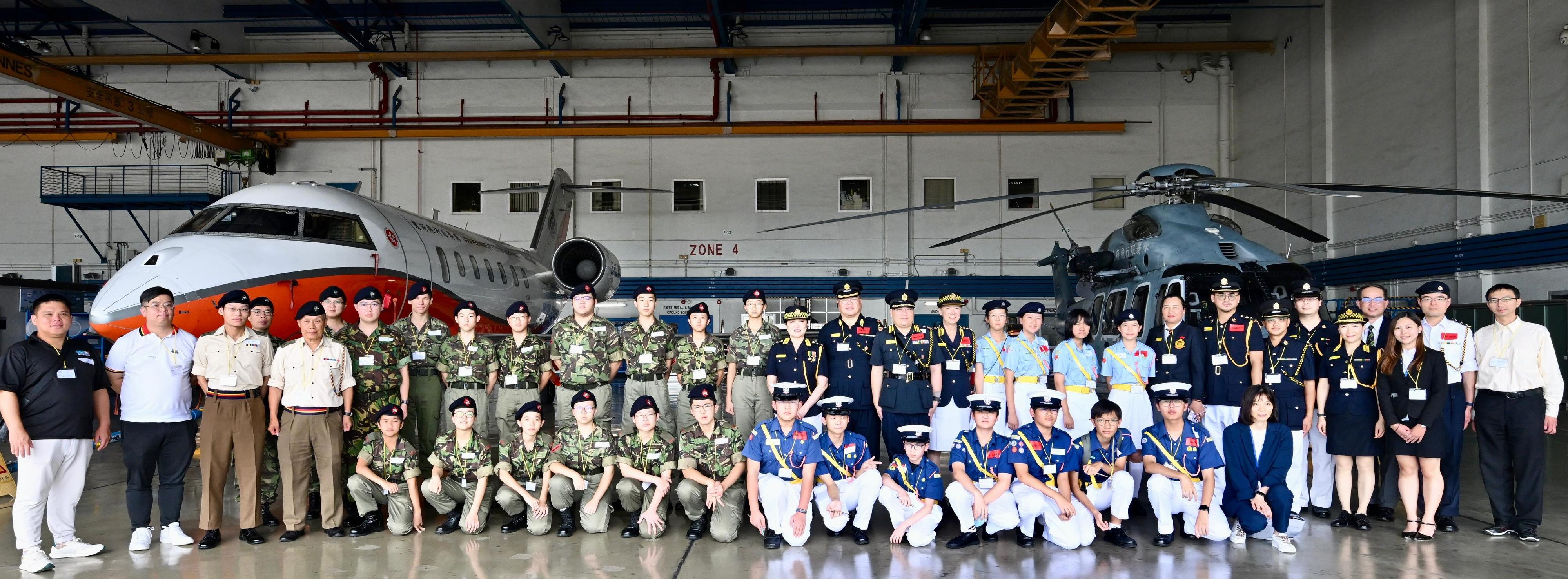 The Civil Aviation Department today (October 4) held an aviation-themed youth activity to celebrate the 76th Anniversary of the founding of the People's Republic of China and commemorate a century of Kai Tak's legacy. Photo shows the participants visiting the Government Flying Service hangar.