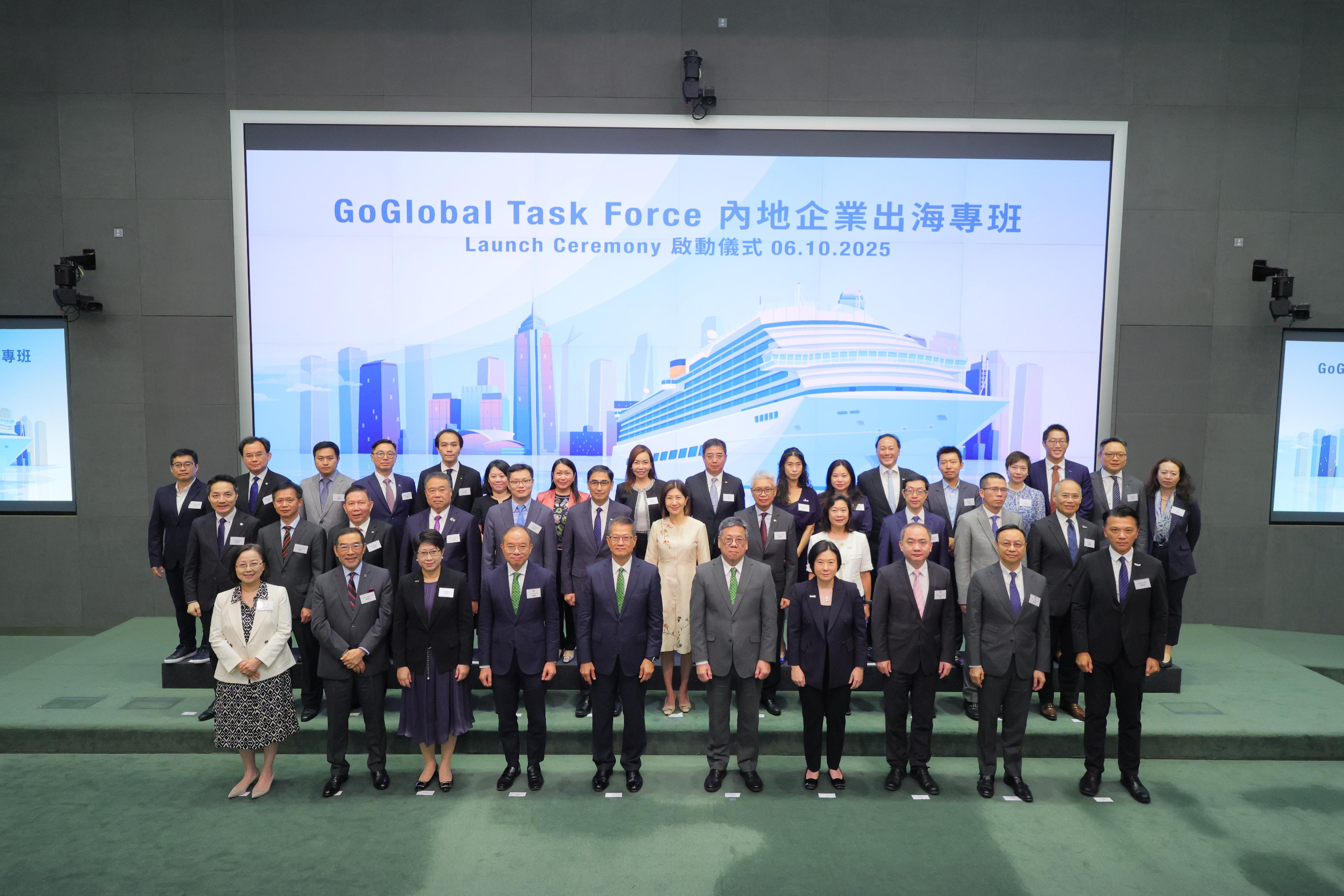 Financial Secretary, Mr Paul Chan (front row, fifth left), and the Secretary for Commerce and Economic Development, Mr Algernon Yau (front row, fifth right), officiate the launch ceremony of the Task Force on Supporting Mainland Enterprises in Going Global (GoGlobal Task Force) today (October 6) with members of the GoGlobal Task Force, including the Secretary for Constitutional and Mainland Affairs, Mr Erick Tsang (front row, fourth left); the Director-General of Invest Hong Kong, Ms Alpha Lau (front row, fourth right); the Executive Director of the Hong Kong Trade Development Council, Ms Sophia Chong (front row, third left); the acting Permanent Secretary for Innovation, Technology and Industry, Dr Ming Ge (front row, third right); the Chairman of Hong Kong Exchanges and Clearing Limited, Mr Carlson Tong (front row, second left); Deputy Chief Executive of Hong Kong Monetary Authority, Mr Darryl Chan (front row, second right); the Chairman of Hong Kong Export Credit Insurance Corporation Advisory Board, Ms Agnes Chan (front row, first left); and Chairman of Hong Kong Productivity Council, Mr Sunny Tan (front row, first right), as well as chambers and partners representatives, including legal, accounting, corporate advisory services consultants, commercial and investment banks and investment funds at the launch ceremony of the Task Force on Supporting Mainland Enterprises in Going Global today (October 6).

