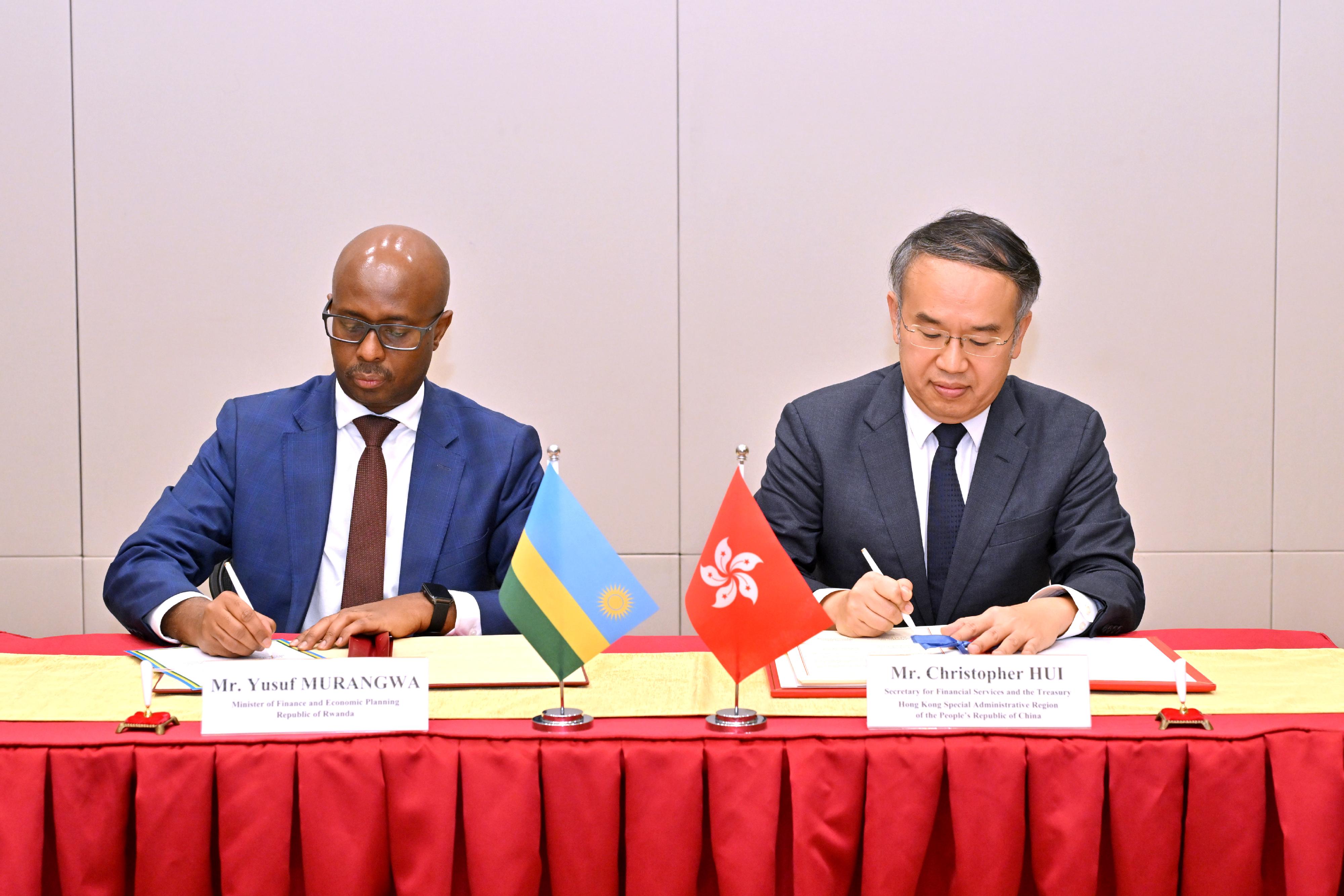 The Secretary for Financial Services and the Treasury, Mr Christopher Hui (right), and the Minister of Finance and Economic Planning of Rwanda, Mr Yusuf Murangwa (left), sign on behalf of the Hong Kong Special Administrative Region Government and the Government of Rwanda respectively a comprehensive avoidance of double taxation agreement today (October 9).