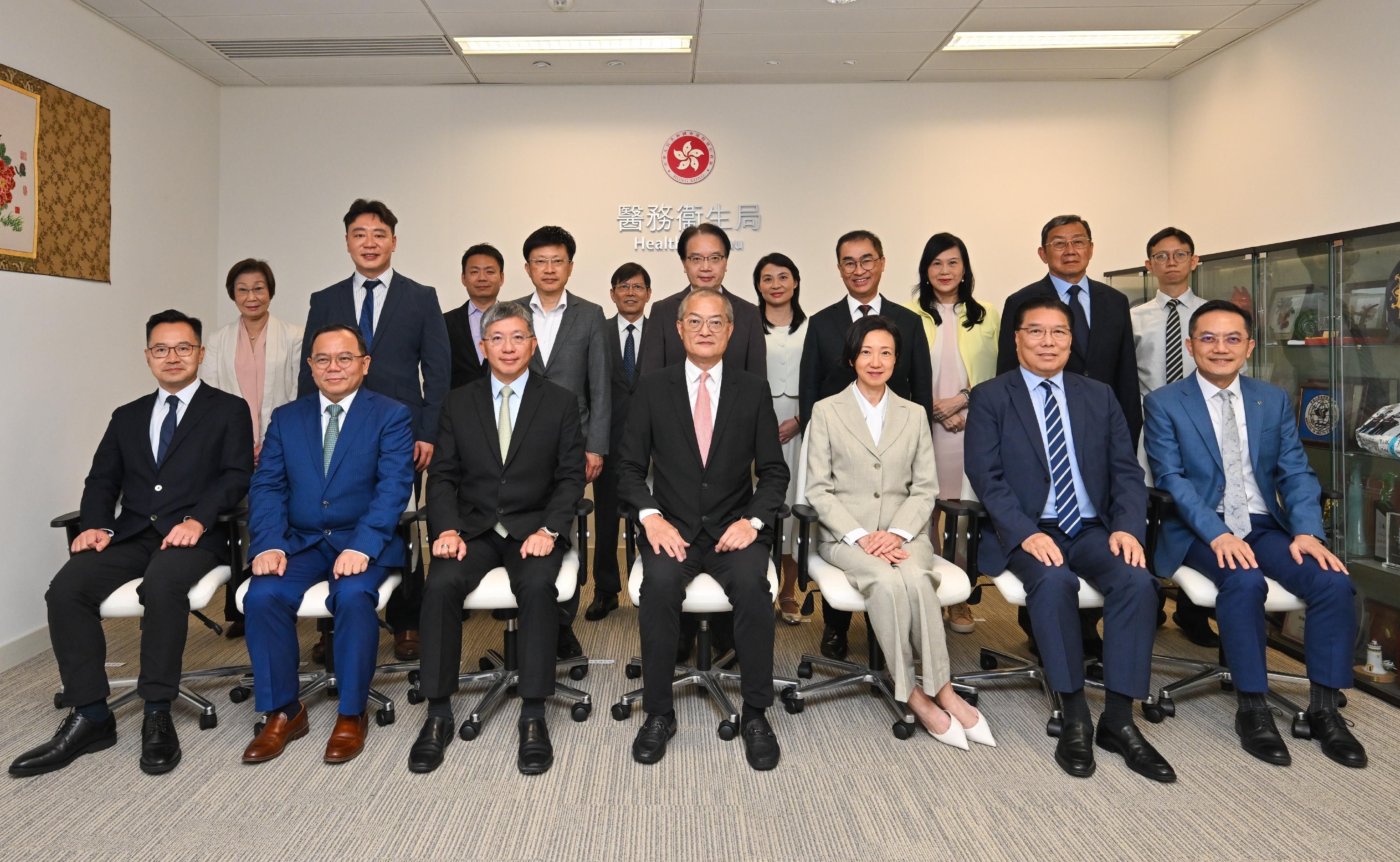 The Secretary for Health, Professor Lo Chung-mau, chaired the joint meeting of the Chinese Medicine Development Committee as well as its Chinese Medicine Practice Subcommittee, Chinese Medicines Industry Subcommittee and Chinese Medicine Development Blueprint Subcommittee today (October 9). Photo shows Professor Lo (first row, centre); the Permanent Secretary for Health, Mr Thomas Chan (first row, third left); the Under Secretary for Health, Dr Cecilia Fan (first row, third right); the Director of Health, Dr Ronald Lam (first row, first right); Deputy Secretary for Health Mr Eddie Lee (first row, first left); the Project Director of the Chinese Medicine Hospital Project Office of the Health Bureau, Dr Cheung Wai-lun (second row, centre); the Director (Strategy and Planning) of the Hospital Authority, Dr Ching Wai-kuen (second row, second left), and other attendees of the meeting.