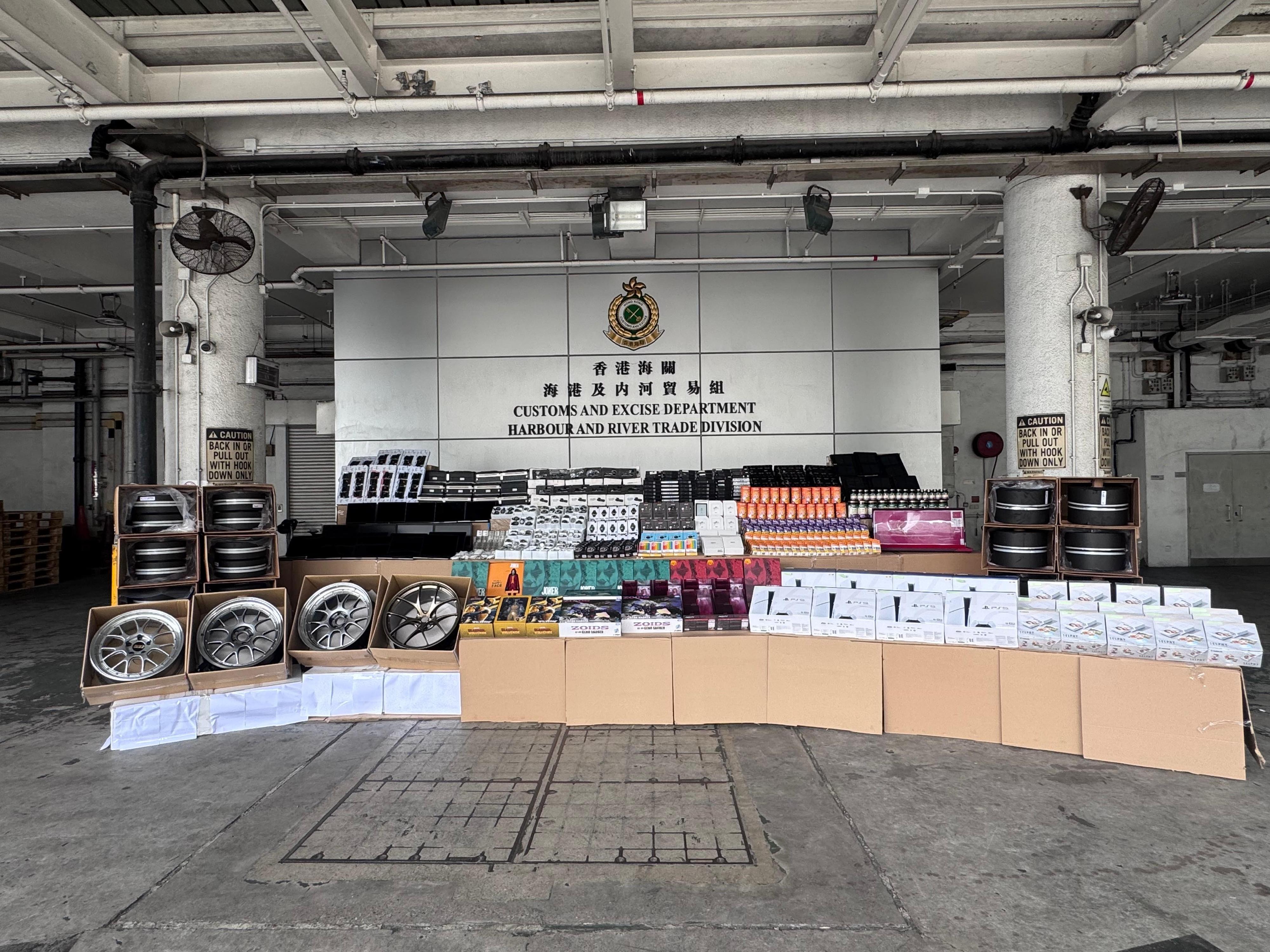 Hong Kong Customs detected two suspected smuggling cases involving ocean-going vessels on September 18 and 26. Large batches of suspected smuggled goods with a total estimated market value of about $170 million were seized. Photo shows some of the suspected smuggled goods seized, including watches, auto parts and toys.
