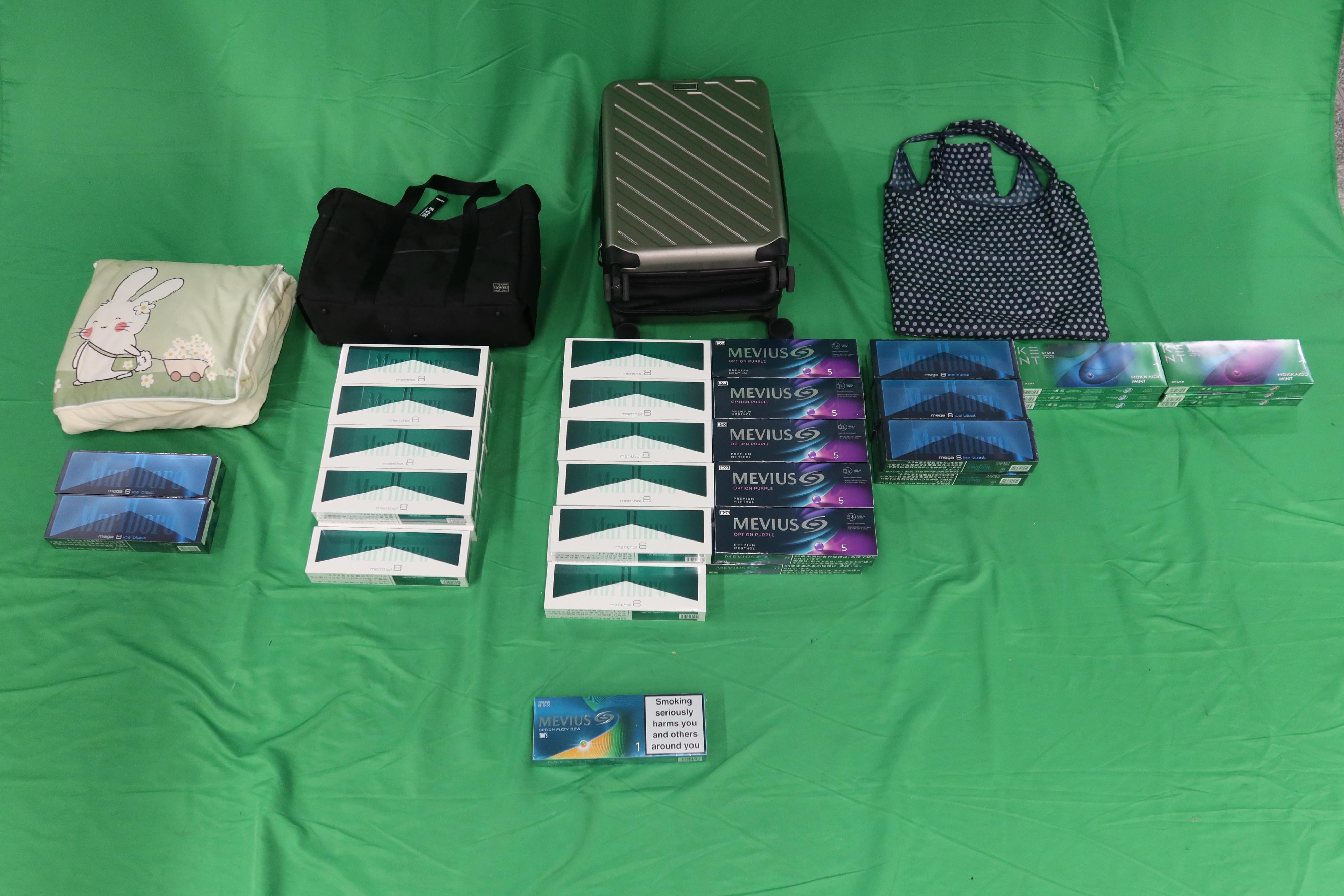 A 34-year-old female incoming passenger was sentenced to two months' imprisonment, suspended for two years and fined $2,000 by the West Kowloon Magistrates' Courts today (October 9) for dealing with duty-not-paid cigarettes and failing to declare them to Customs officers, in contravention of the Dutiable Commodities Ordinance. Photo shows the duty-not-paid cigarettes seized.