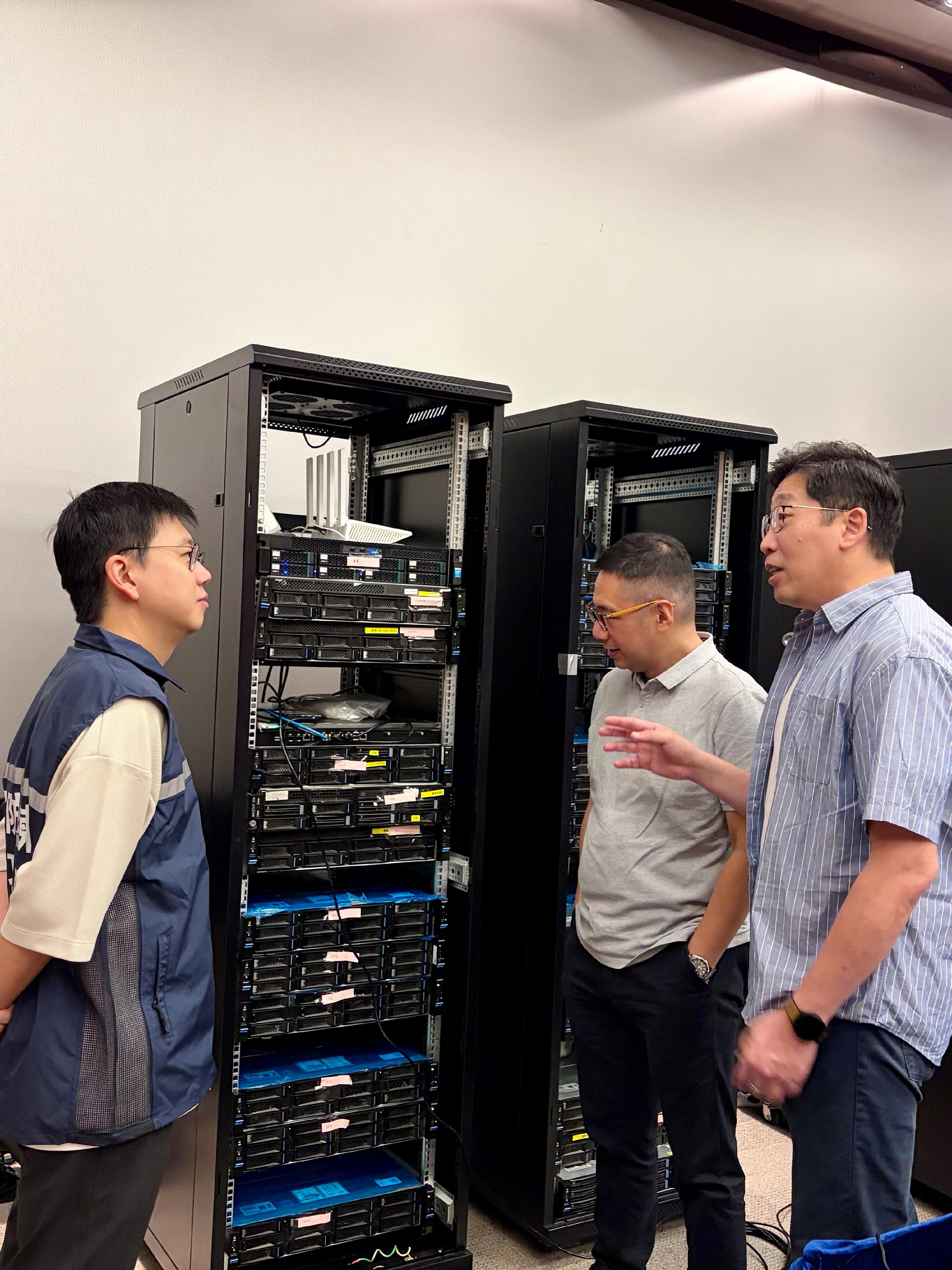 During the Hong Kong Cybersecurity Attack and Defence Drill 2025, the Deputy Commissioner (Digital Infrastructure), Mr Daniel Cheung (right), visited the venue and was briefed on the exercise's progress.