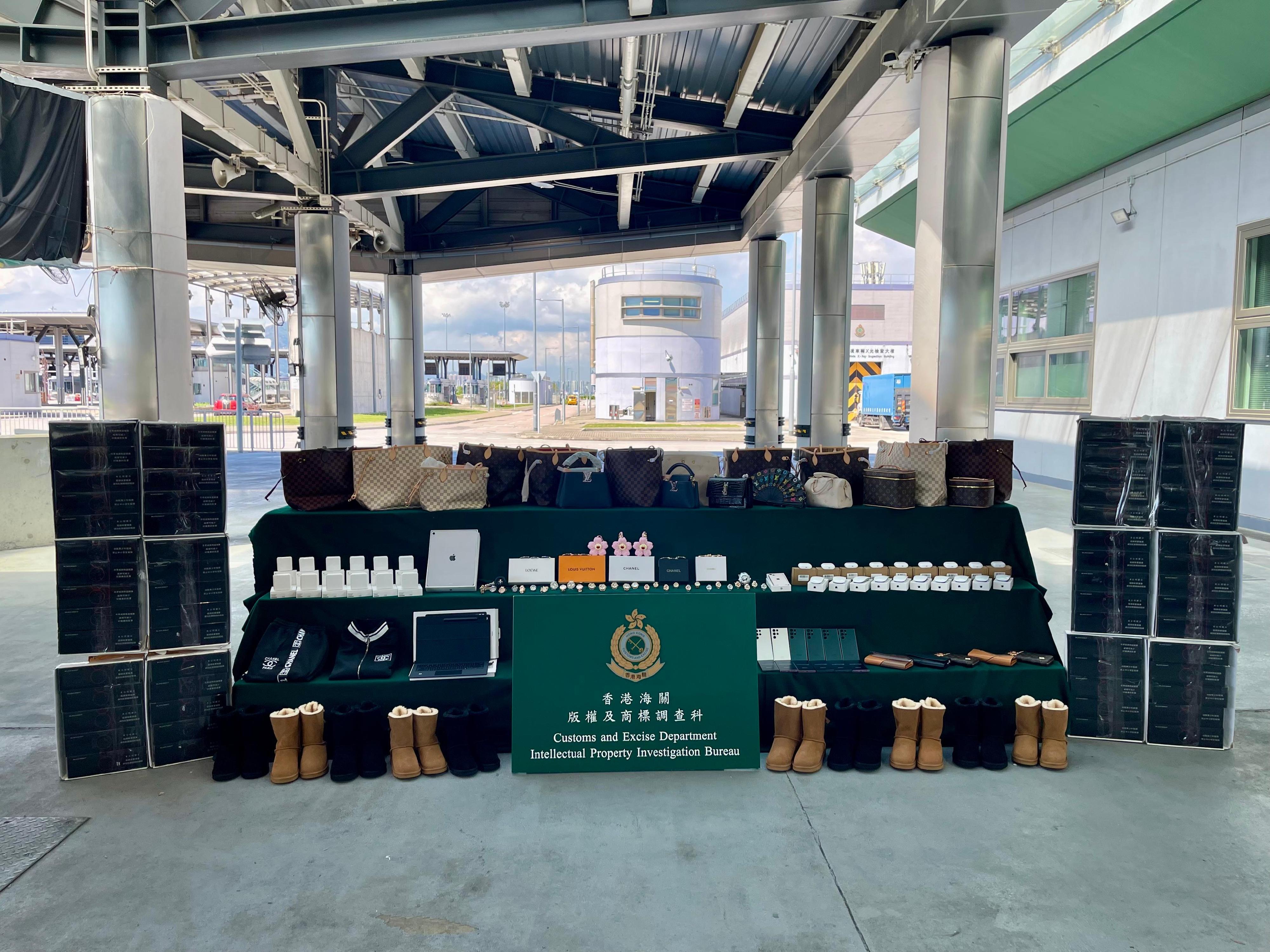 Hong Kong Customs on September 11 seized about 3 700 suspected counterfeit goods and about 70 000 suspected illicit cigarettes with a total estimated market value of about $1.7 million at the Hong Kong-Zhuhai-Macao Bridge Hong Kong Port. Photo shows the suspected counterfeit goods and suspected illicit cigarettes seized.