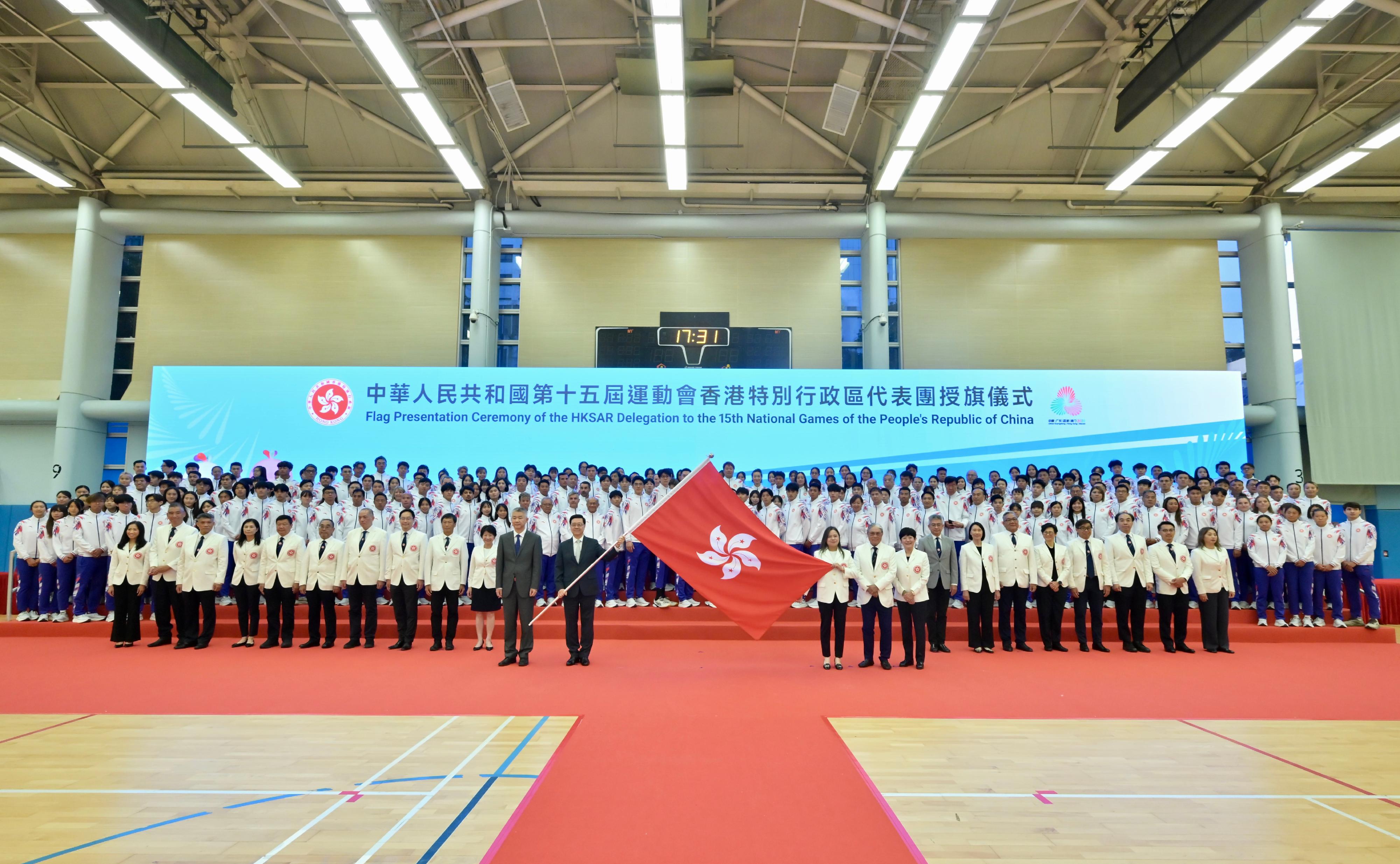 The Chief Executive, Mr John Lee, attended the flag presentation ceremony of the Hong Kong Special Administrative Region (HKSAR) Delegation to the 15th National Games of the People's Republic of China today (October 15). Photo shows Mr Lee (front row, second left), accompanied by Deputy Director of the Liaison Office of the Central People's Government in the HKSAR Mr Sun Shangwu (front row, first left), presenting the HKSAR flag to the Secretary for Culture, Sports and Tourism and Head of the HKSAR Delegation, Miss Rosanna Law (front row, third right); the President of the Sports Federation & Olympic Committee of Hong Kong, China and Chairman of the Organising Committee of the Delegation, Mr Timothy Fok (front row, second right); and the President of the China Hong Kong Paralympic Committee and Chairman of the Organising Committee of the Delegation, Mrs Jenny Fung (front row, first right).