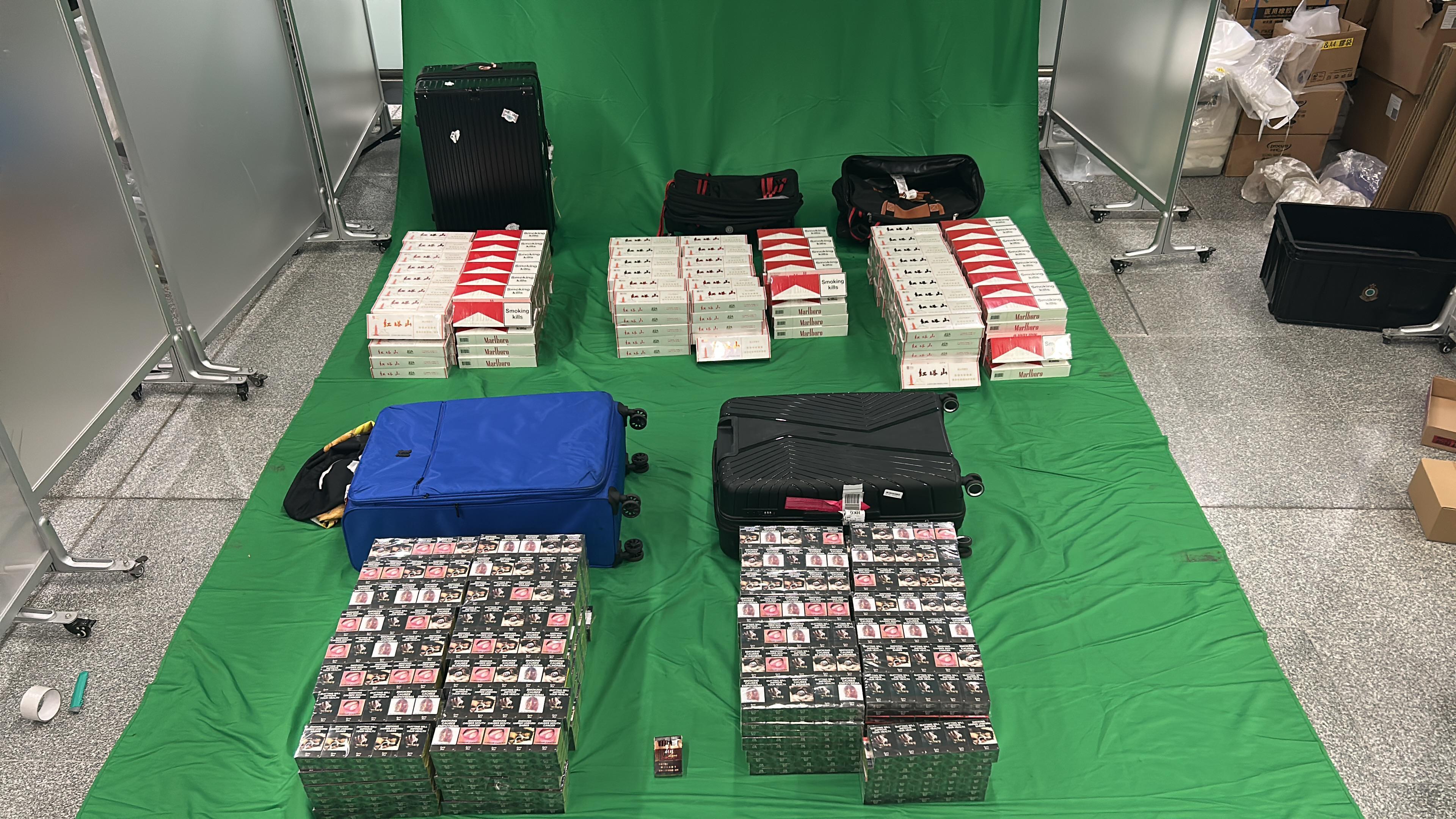 A 39-year-old incoming male passenger was sentenced to nine months' imprisonment and fined $1,000 by the West Kowloon Magistrates' Courts today (October 16) for importing duty-not-paid cigarettes and failing to declare to Customs officers, in contravention of the Dutiable Commodities Ordinance. Photo shows the duty-not-paid cigarettes seized.
