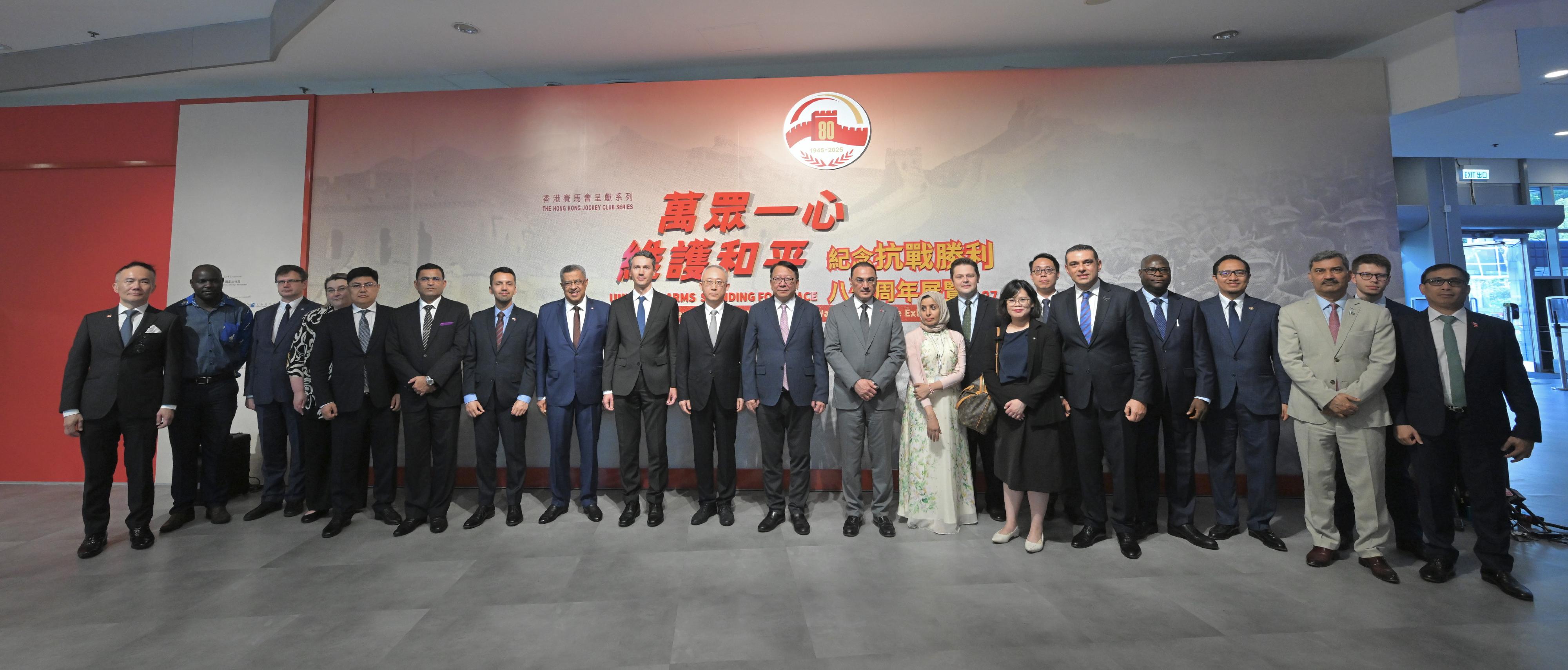 The Chief Secretary for Administration, Mr Chan Kwok-ki, attended the special visit arranged by the Office of the Commissioner of the Ministry of Foreign Affairs of the People's Republic of China in the Hong Kong Special Administrative Region to "United in Arms, Standing for Peace: 80th Anniversary of Chinese Victory in War of Resistance Exhibition" today (October 17). Photo shows Mr Chan (front row, seventh left); Deputy Commissioner of the Office of the Commissioner of the Ministry of Foreign Affairs of the People's Republic of China in the Hong Kong Special Administrative Region Mr Li Yongsheng (front row, sixth left), and other guests at the event.