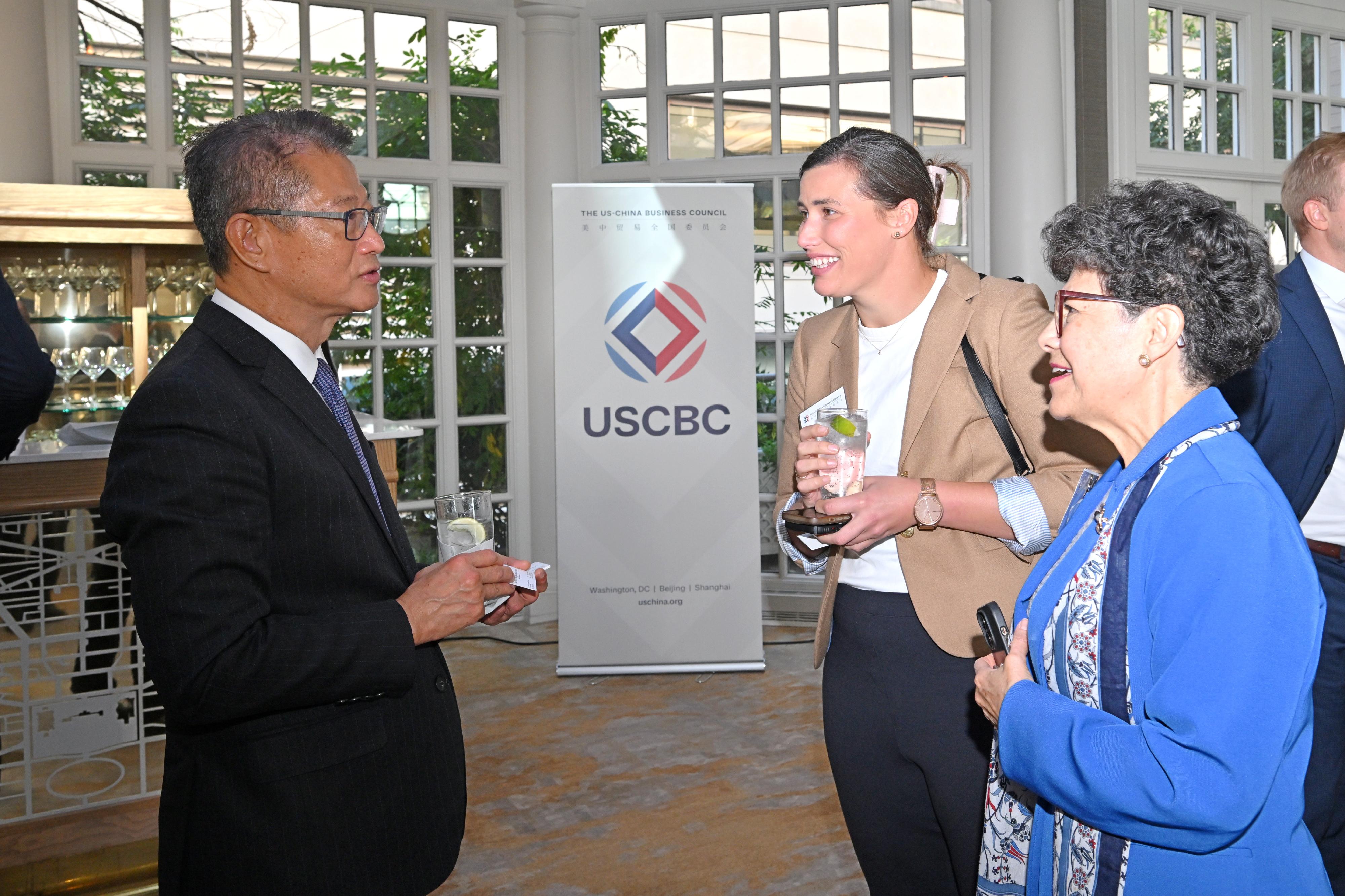 The Financial Secretary, Mr Paul Chan, continued his visit in Washington, DC, the US yesterday (October 17, Washington time) to attend the Annual Meetings of the International Monetary Fund (IMF) and World Bank Group. Photo shows Mr Chan attending a business luncheon co-hosted by the US-China Business Council and the Hong Kong Economic and Trade Office in Washington, and exchanging with participants. 
