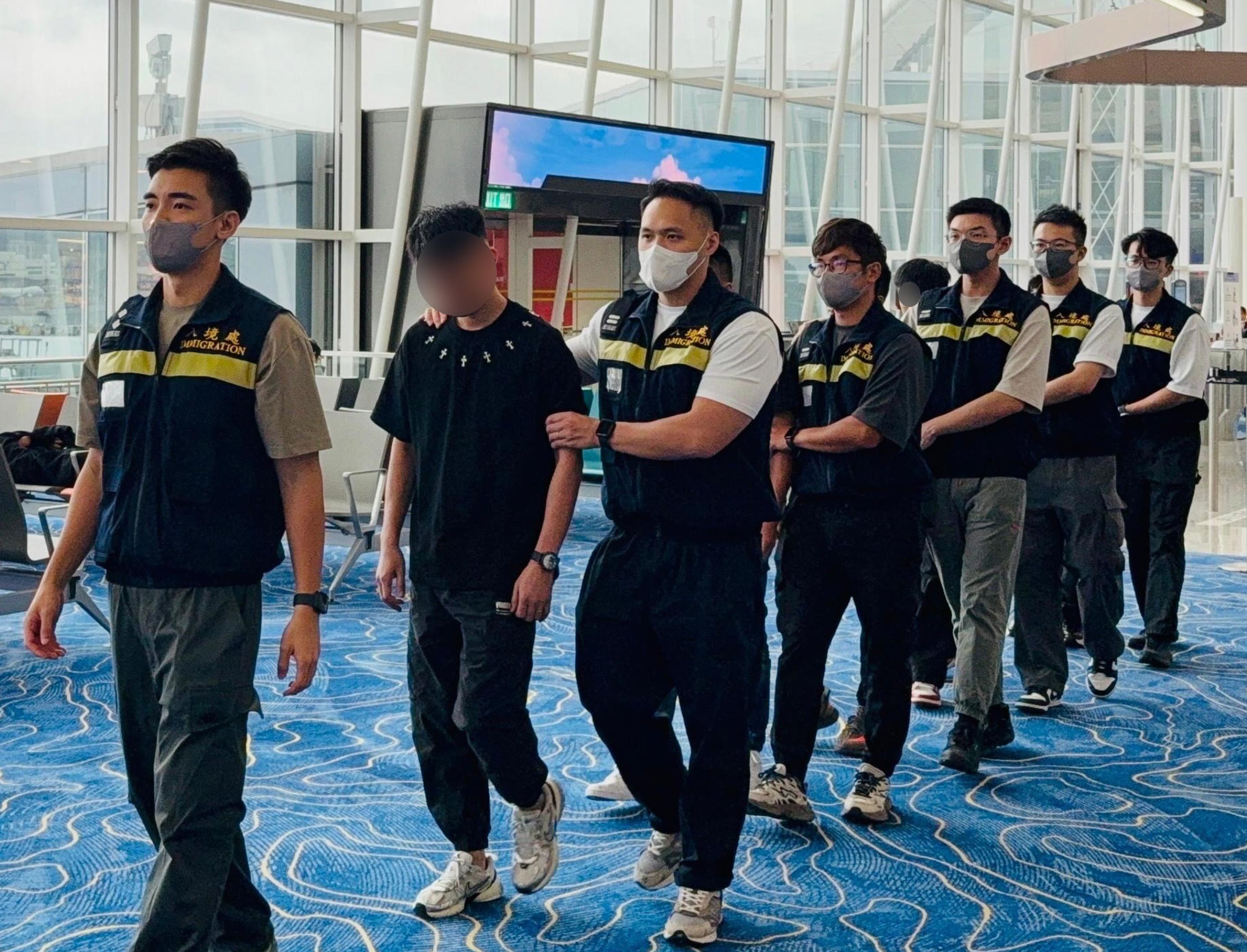 The Immigration Department (ImmD) carried out repatriation operations from October 20 to today (October 24). A total of 90 unsubstantiated non-refoulement claimants were repatriated to their places of origin. Photo shows removees being escorted by ImmD officers to depart from Hong Kong.