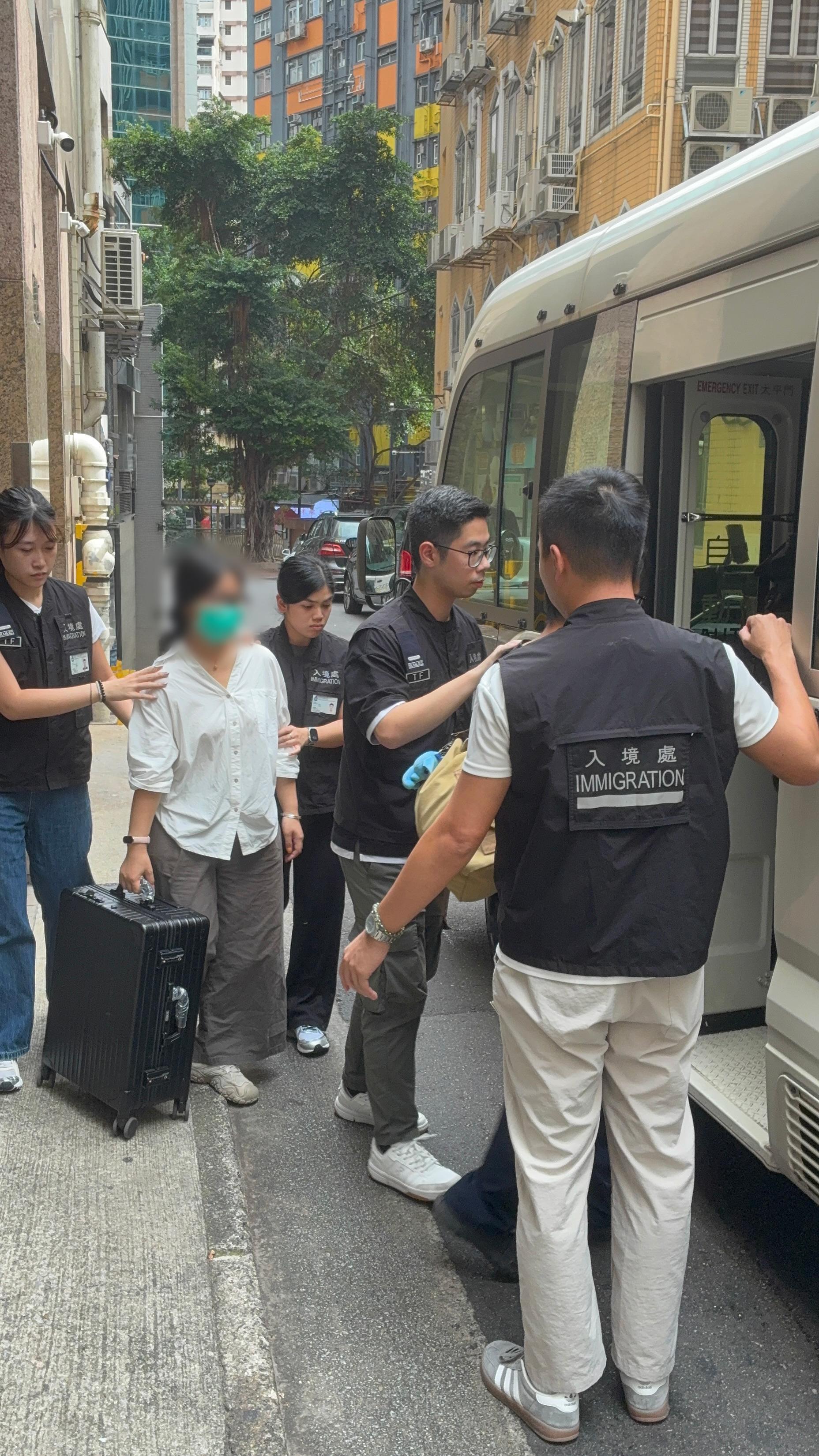 The Immigration Department mounted a series of territory-wide anti-illegal worker operations codenamed "Rally", "Lightshadow", "Puncture", and a joint operation with the Hong Kong Police Force codenamed "Champion", from October 17 to yesterday (October 23). Photo shows suspected illegal workers arrested during an operation.