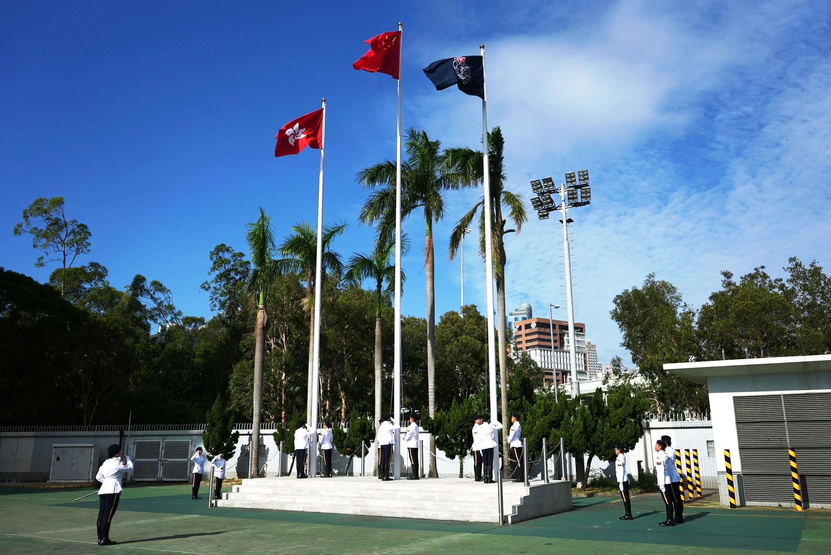 The Civil Aid Service (CAS) Cadet Corps held the 150th New Cadets Passing-out Parade at the CAS Headquarters today (October 25). Photo shows the Cadet Corps Guard of Honour performing a flag-raising ceremony.