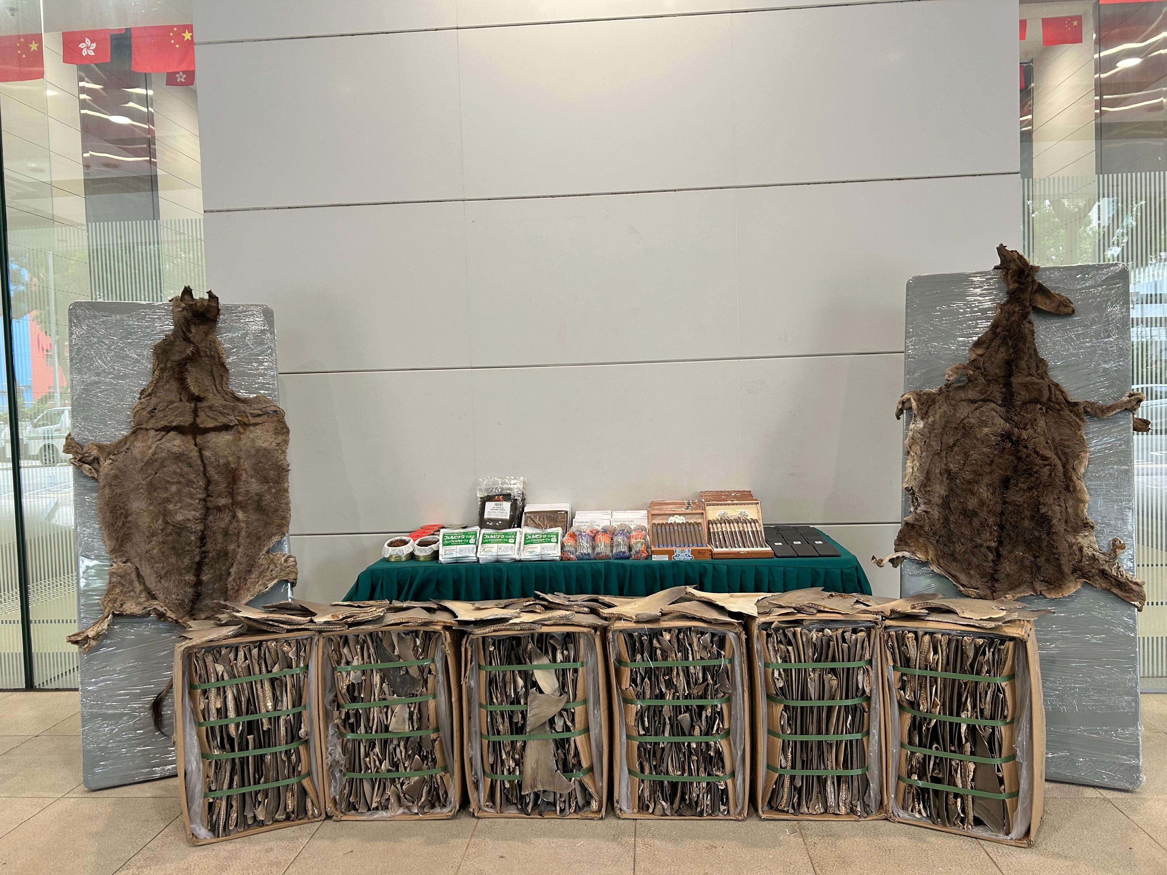 Hong Kong Customs detected two suspected smuggling cases involving a river trade vessel and an ocean-going vessel on October 3 and 7 respectively. Large batches of suspected smuggled goods with a total estimated market value of about $200 million were seized. Photo shows the  suspected smuggled goods seized.