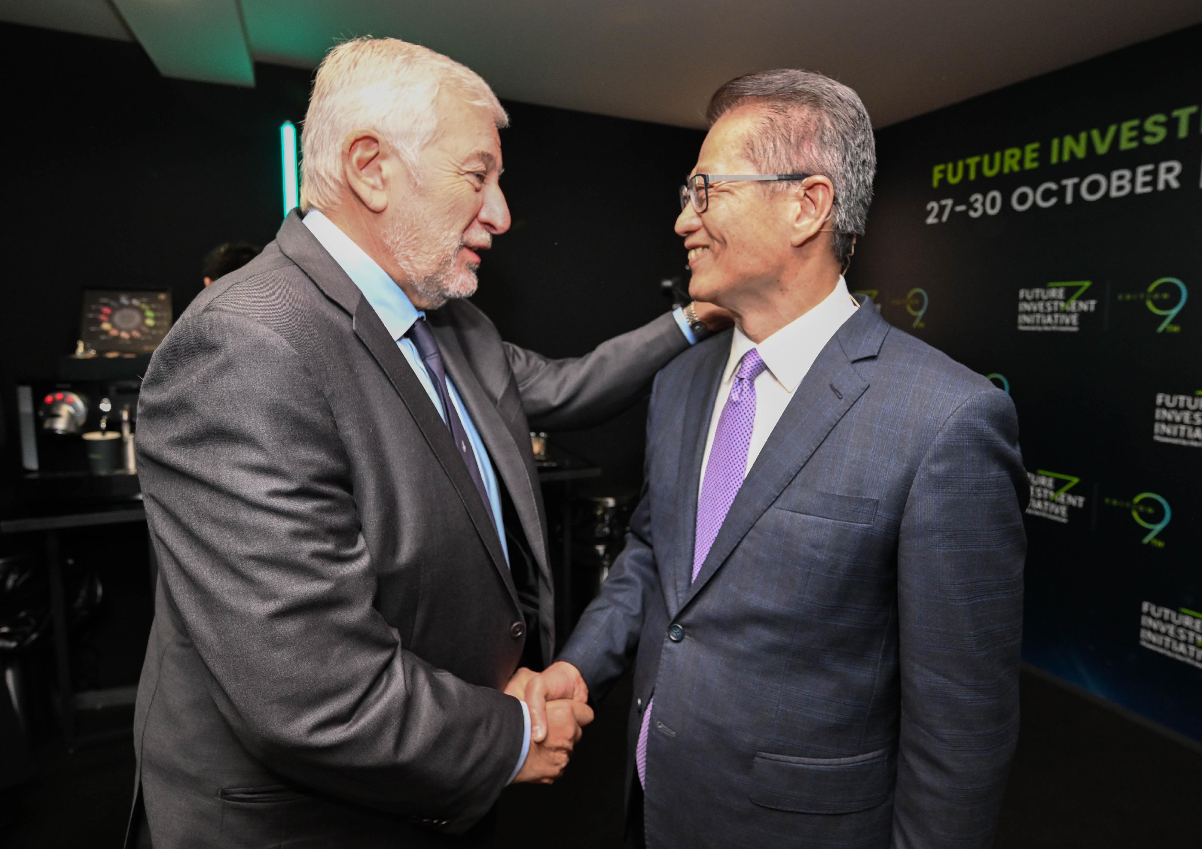 The Financial Secretary, Mr Paul Chan, led a delegation from the financial and innovation sectors on a visit to Riyadh, Saudi Arabia, on October 28 (Riyadh time). Photo shows Mr Chan (right) and other guest attending the Future Investment Initiative.