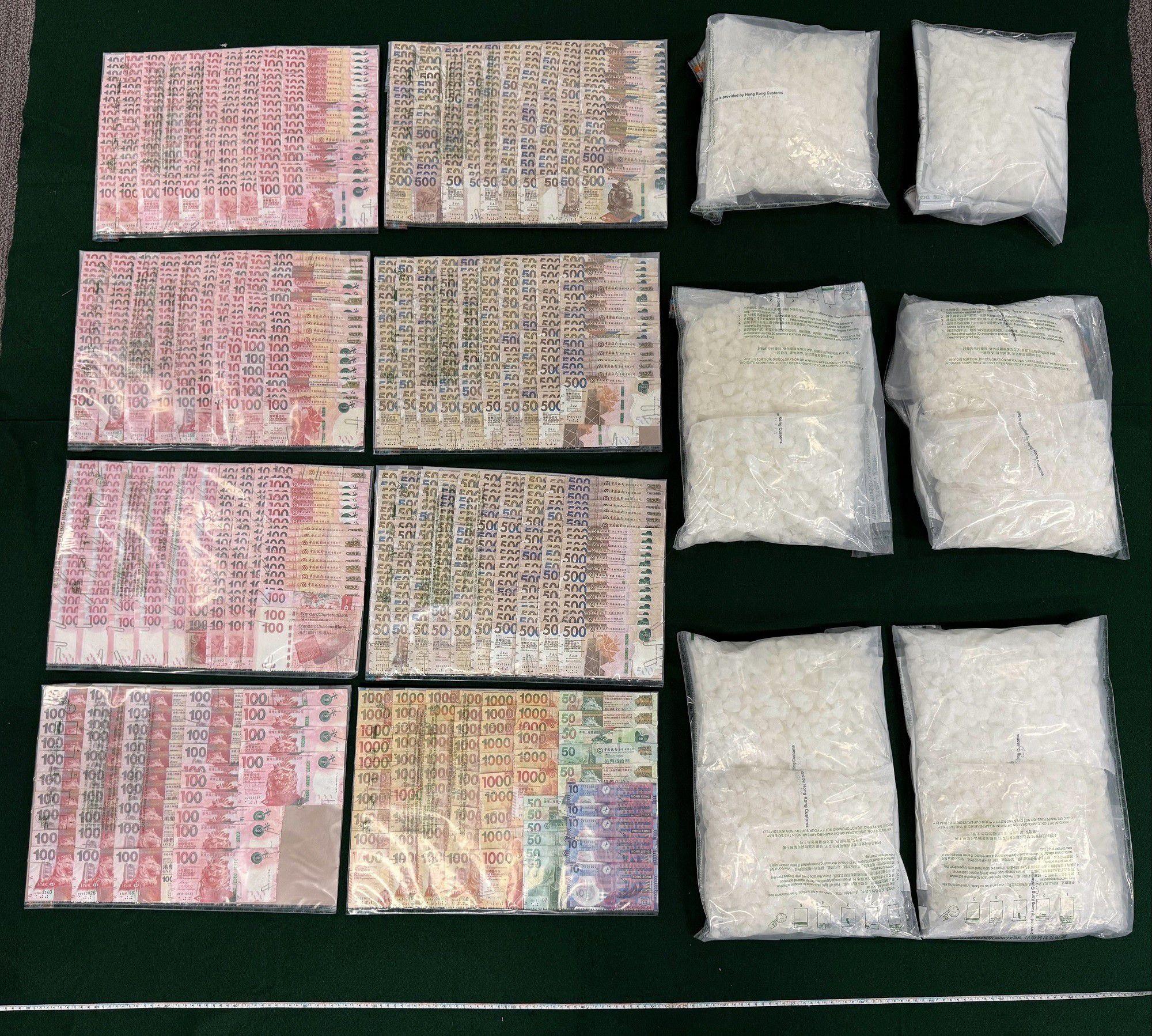 Hong Kong Customs intercepted two express parcels from Belgium, declared as pesticides, that were sent to Hong Kong via the Chinese Mainland on October 24 and yesterday (October 28) and discovered a total of 20 kilograms of suspected ketamine concealed inside plastic buckets from the parcels. The total estimated market value was about $9 million. Photo shows the suspected ketamine seized and the cash seized from the private car of the 21-year-old arrested man.