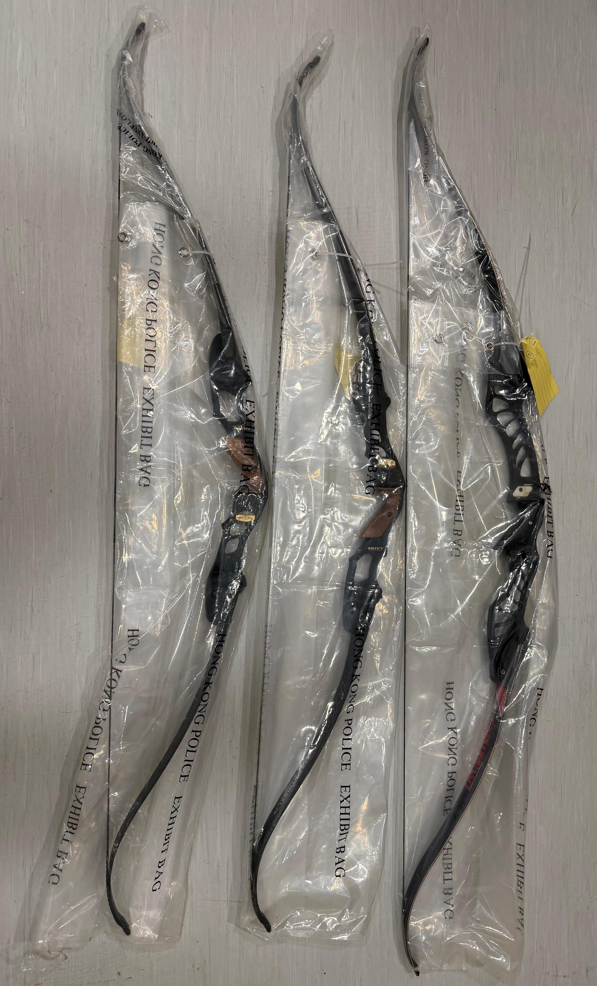 Police seized three compound bows with twelve arrows and two katanas during the operation.