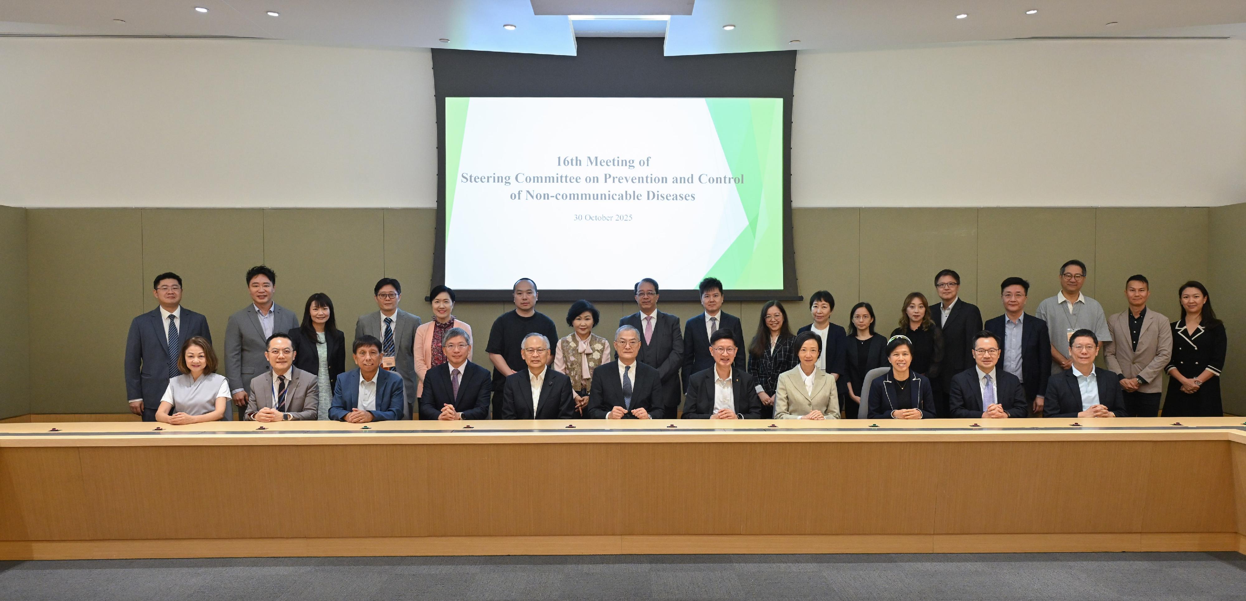 The Secretary for Health, Professor Lo Chung-mau, chairs the 16th meeting of the Steering Committee on Prevention and Control of Non-Communicable Diseases today (October 30). Photo shows Professor Lo (front row, centre); the Permanent Secretary for Health, Mr Thomas Chan (front row, fourth left); the Under Secretary for Health, Dr Cecilia Fan (front row, fourth right); the Director of Health, Dr Ronald Lam (front row, second left); Deputy Secretary for Health Mr Eddie Lee (front row, second right); and other members.