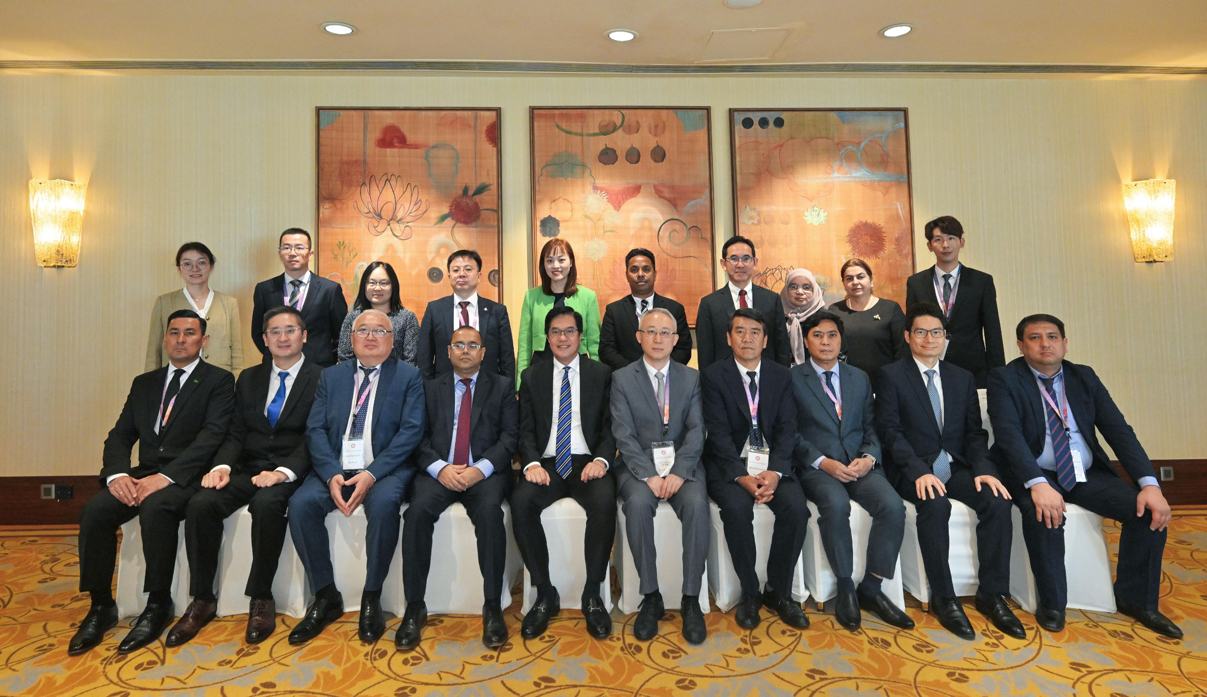 A delegation of 10 overseas government officials completed their visit to Hong Kong today (October 30). Photo shows the Acting Financial Secretary, Mr Michael Wong (front row, fifth left); the Acting Secretary for Commerce and Economic Development, Dr Bernard Chan (front row, second left); the Under Secretary for Financial Services and the Treasury, Mr Joseph Chan (front row, second right); the Under Secretary for Innovation, Technology and Industry, Ms Lillian Cheong (back row, fifth left); the Under Secretary for Development, Mr David Lam (back row, fourth right); and the Acting Government Economist, Dr Cecilia Lam (back row, third left), with the delegation.