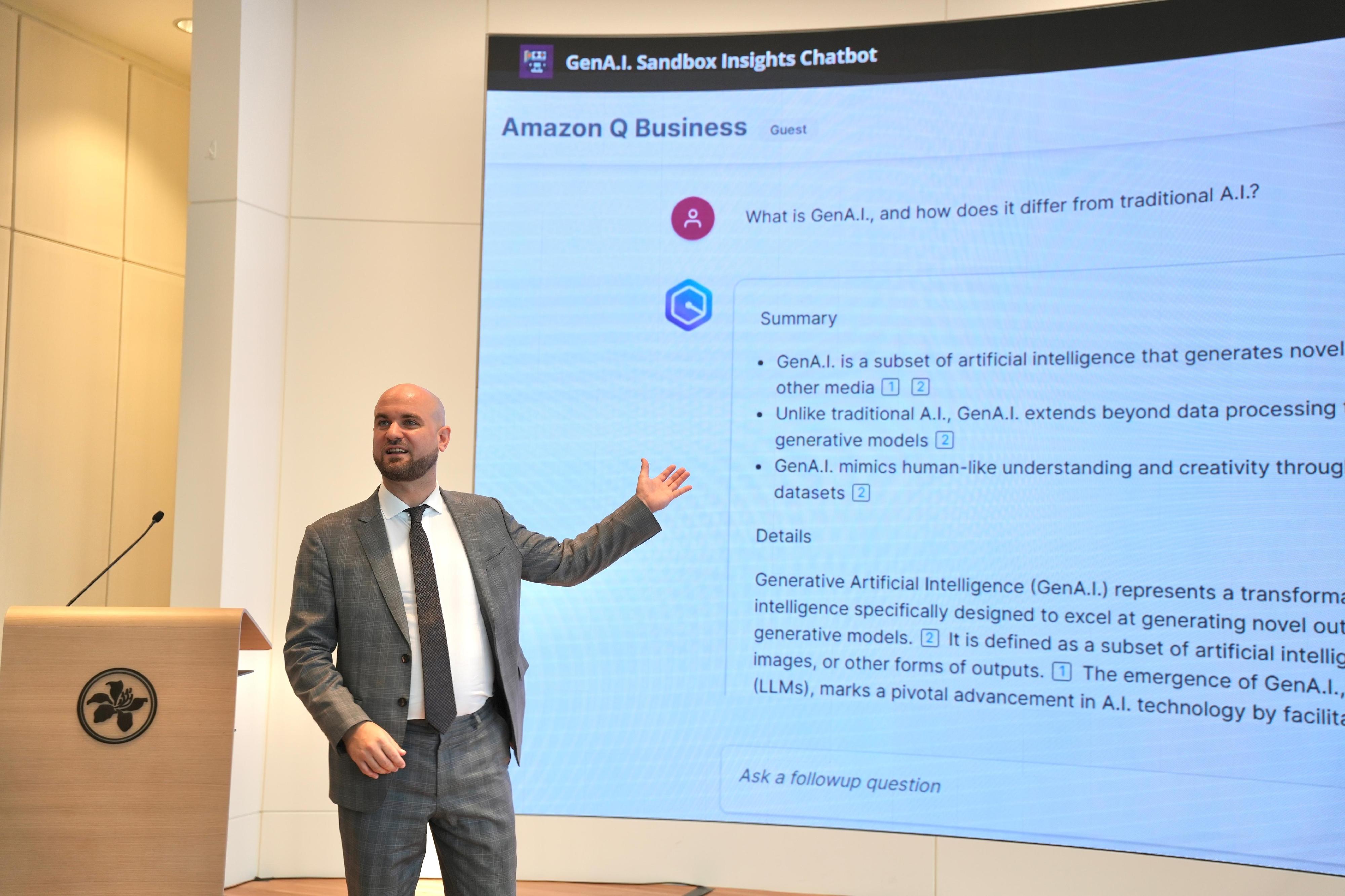 The Hong Kong Monetary Authority (HKMA), in collaboration with the Hong Kong Cyberport Management Company Limited (Cyberport), hosted the Generative Artificial Intelligence (GenA.I.) Symposium today (October 31). Photo shows a representative from the Amazon Web Services showcasing the knowledge-bound GenA.I. chatbot developed in collaboration with the HKMA for interactive access to practical guidance for the GenA.I. Sandbox. 