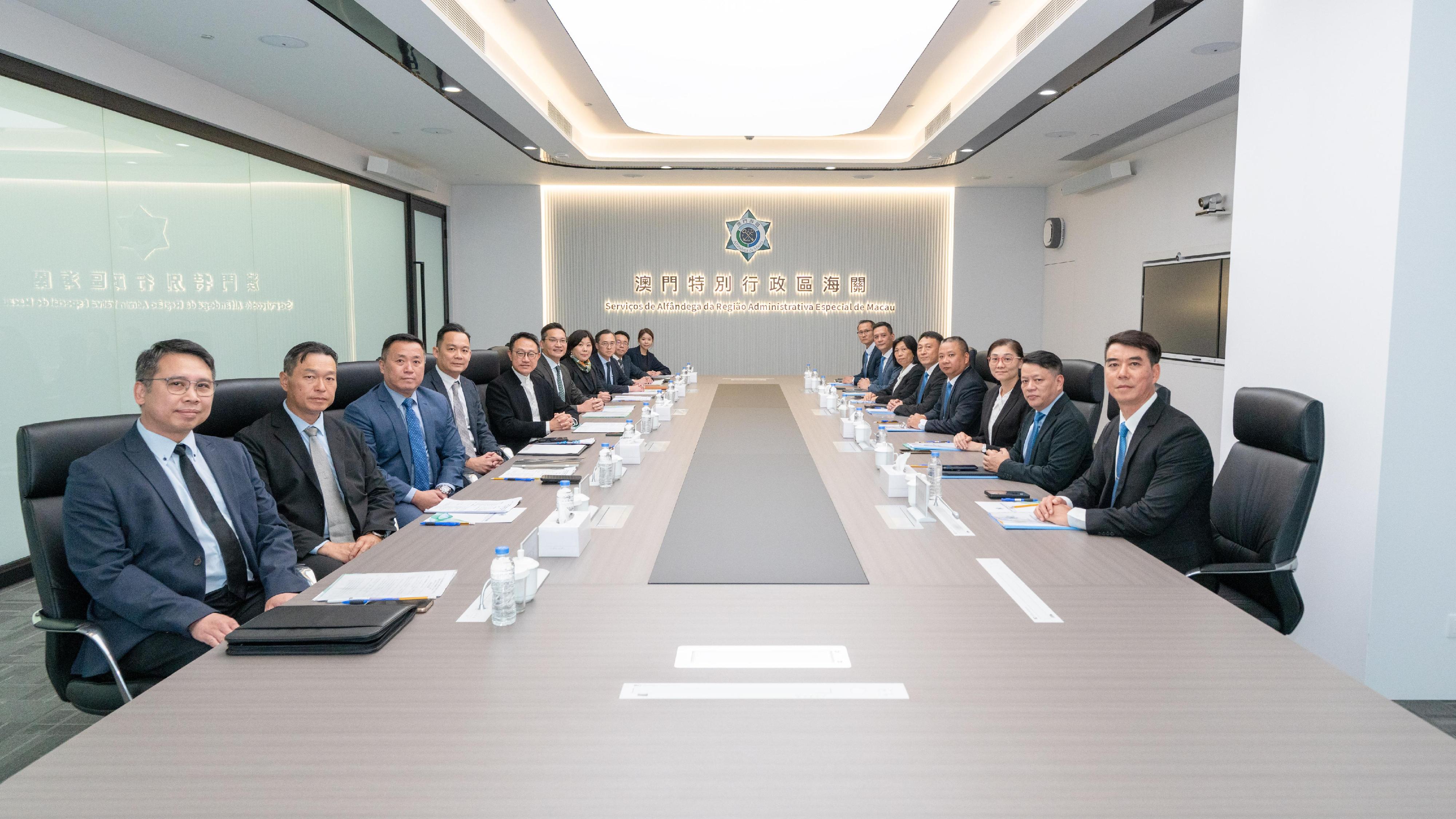 The Commissioner of Customs and Excise, Mr Chan Tsz-tat, led a delegation to attend the 39th Annual Meeting between Hong Kong Customs and the Macao Customs Service/Macao Economic and Technological Development Bureau held in Macao today (October 31). Photo shows Mr Chan (fifth left); the Deputy Director-General of the Macao Customs Service, Mr Lei Iok-fai (fourth right); the Assistant Commissioner (Excise and Strategic Support) of Customs and Excise, Mr Lawrence Ng (sixth left); the Assistant Director-General of the Macao Customs Service, Mr Ip Va-chio (fifth right), and delegation members of both sides during the meeting.  